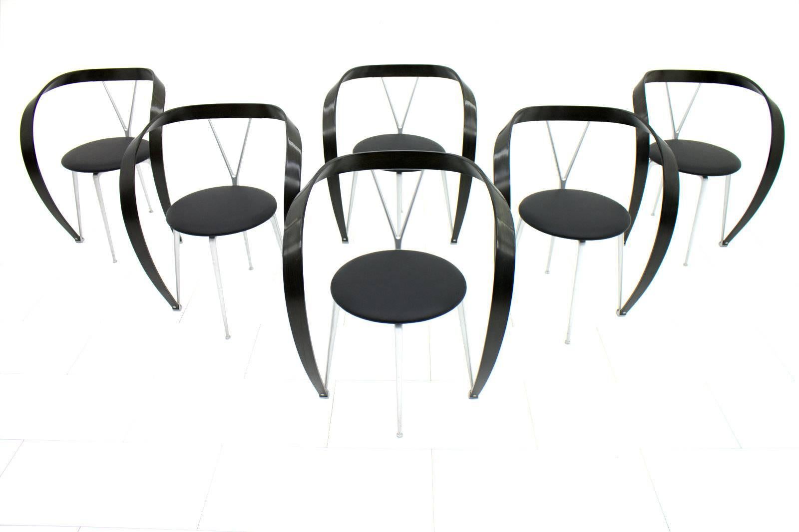 Very decorative set of six dining chairs by Andrea Branzi for Cassina, 1993.
New black leather seats, black painted curved wood armrests. 
Very good original condition.

Worldwide shipping.