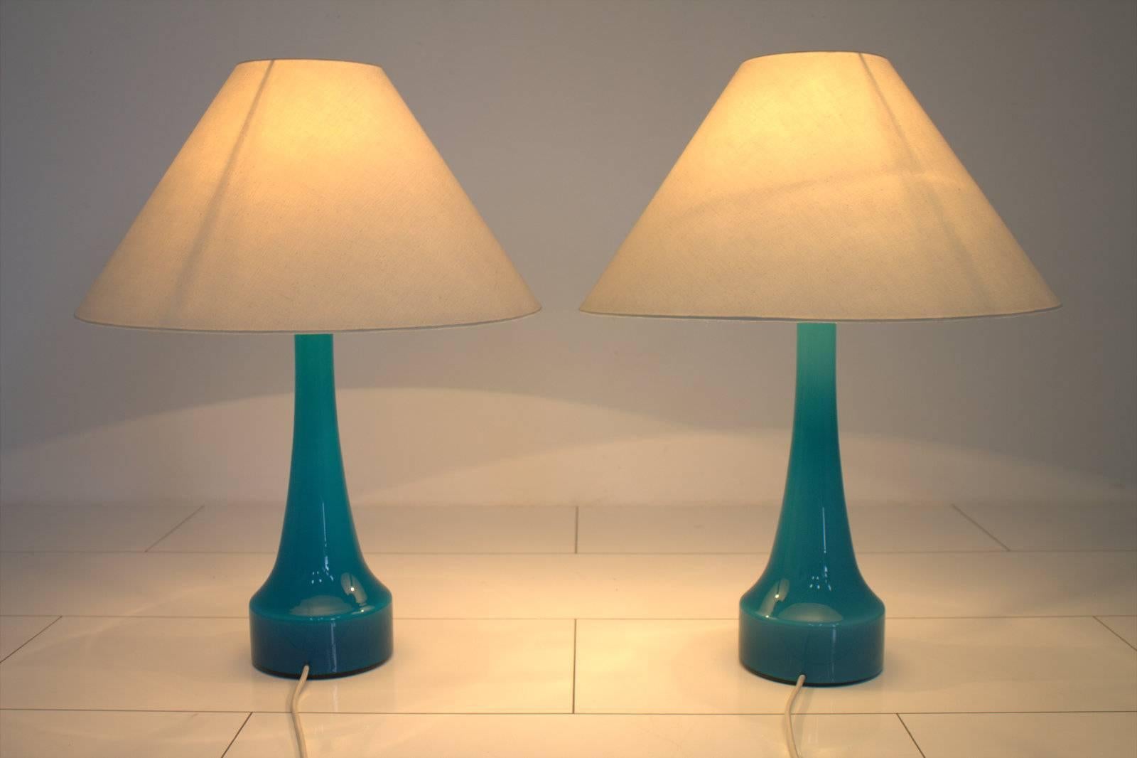 Nice pair of blue glass table lamps by Holmegaard, Denmark circa 1960s. Original shades. 
Very good original condition.

Worldwide shipping.

