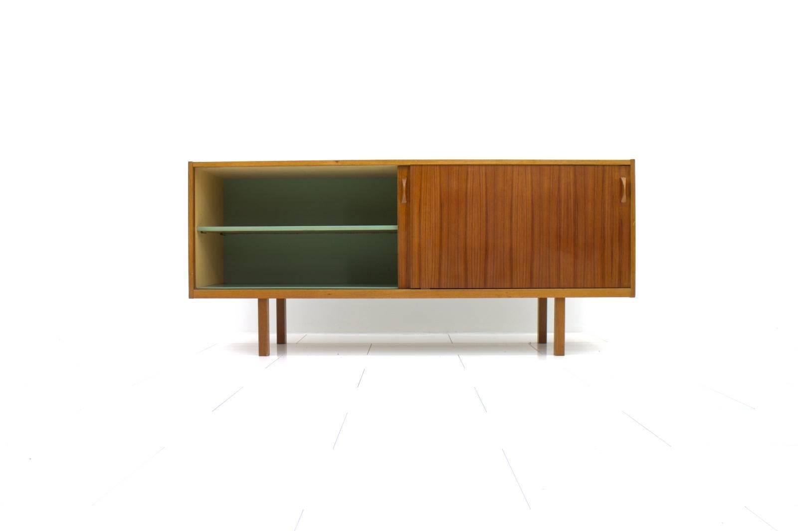 Teak Wood Sideboard from Sweden 1960s.
Two sliding doors and two drawers inside.

Good condition

Worldwide shipping.
