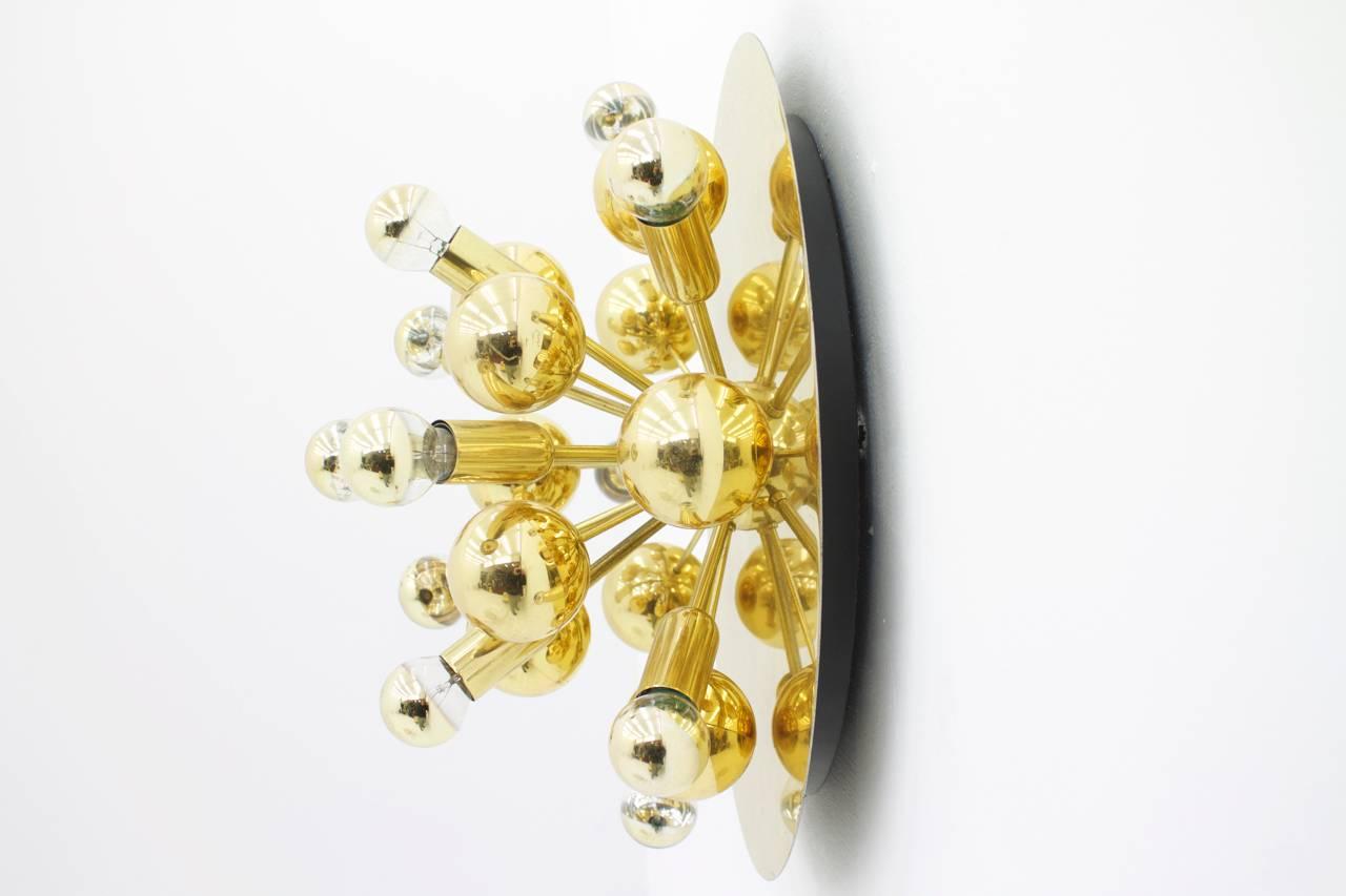 Nice golden wall sconce, Germany, 1960s. Ten bulbs with an E 14 socket.

Good original condition.

Worldwide shipping.