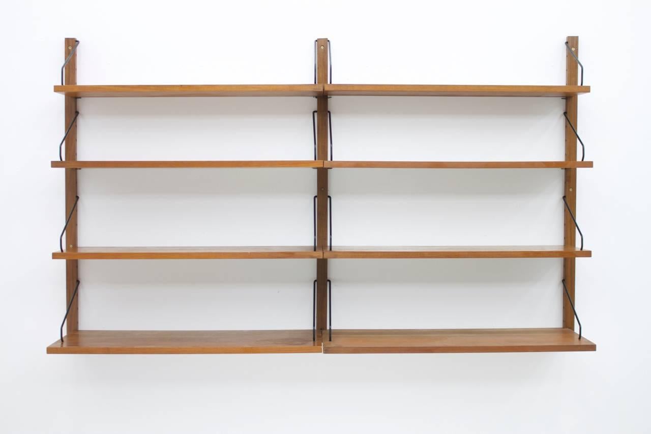 Poul Cadovius Royal wall system, shelf, teakwood, Denmark, 1960s.

3 x teak wall holder.
Eight shelves (2 x 80 x 20 cm, 4 x 80 x 24 cm, 2 x 80 x 30 cm).
Height 100 cm, width 164 cm.

A second similar shelf is also available.

Worldwide