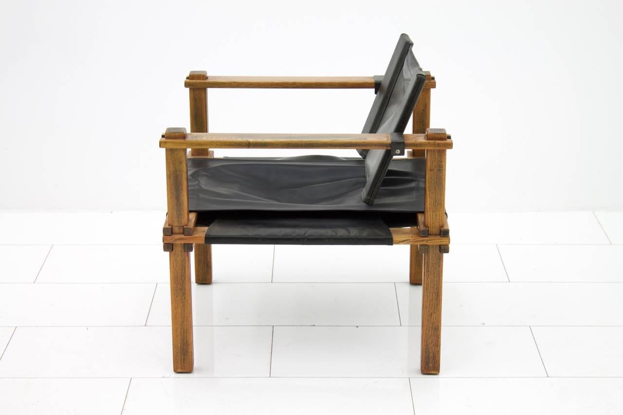 Lounge chair in oak and black Leather.
Designed by Gerd Lange, 1965 and made by Bofinger, Germany.
Measures: D 65 cm, H 70 cm, SH 37 cm.
Good original condition with a fantastic patina.