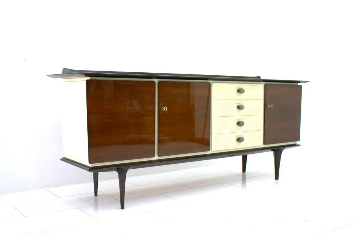 Mahogany sideboard with brass details and white lacquered parts. Beautiful details,
Germany, circa 1950s.
Good original condition.