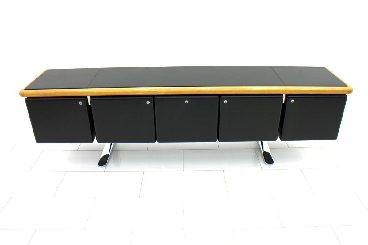 Large leather coated sideboard with five cabinets. Floating in a chromed base. All original keys are include.

Very good condition.

Worldwide shipping.