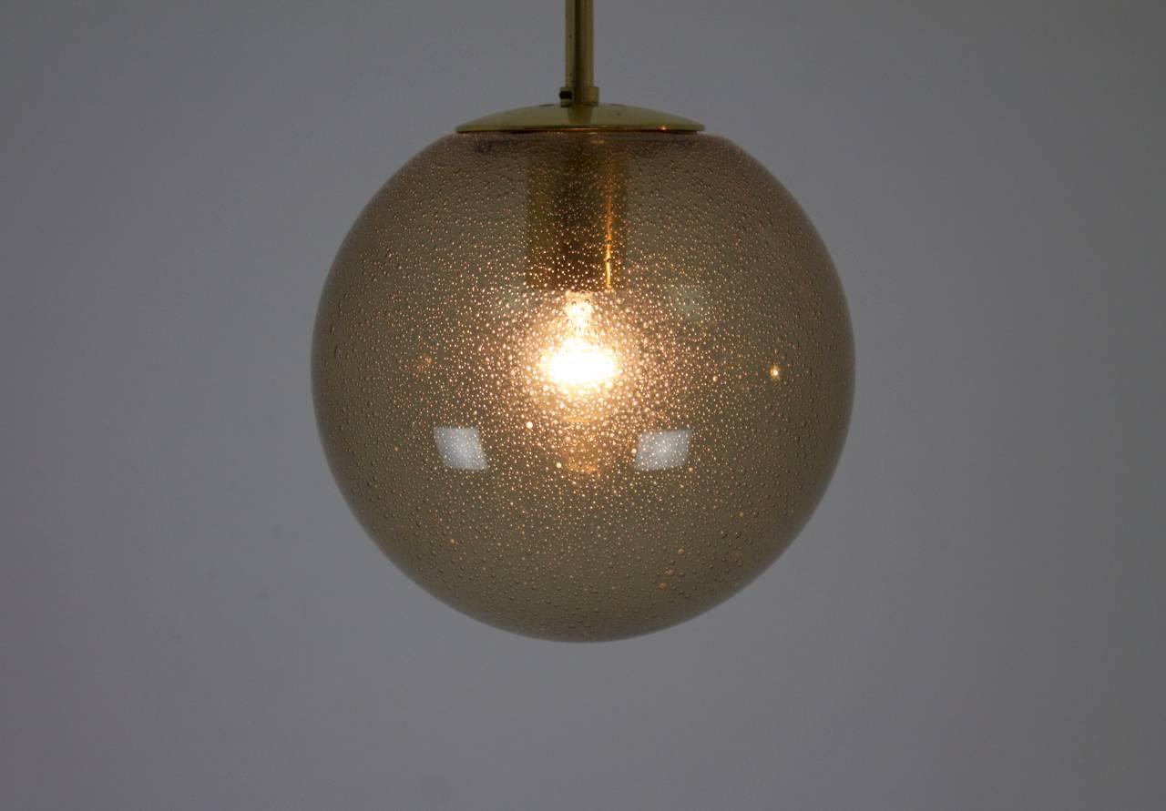 German Limburg Pair of Smoked Glass and Brass Glass Ball Pendants 1960s
