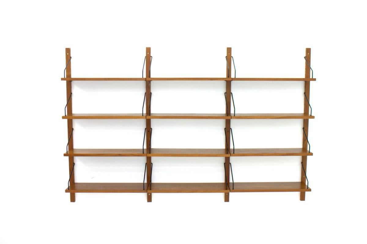 Poul Cadovius royal teak book shelf, Cado Denmark.

12 x teak shelves
four x wall holder
metal parts.

Good condition.

Worldwide shipping.
