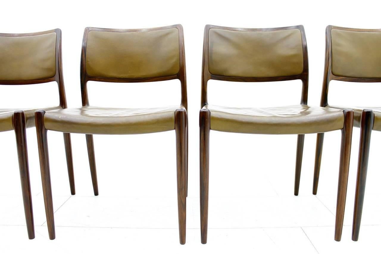 Rare set of four Niels O. Møller dining room chairs model 80 with beautiful brown leather. Good original condition with great patina. 

Worldwide shipping.