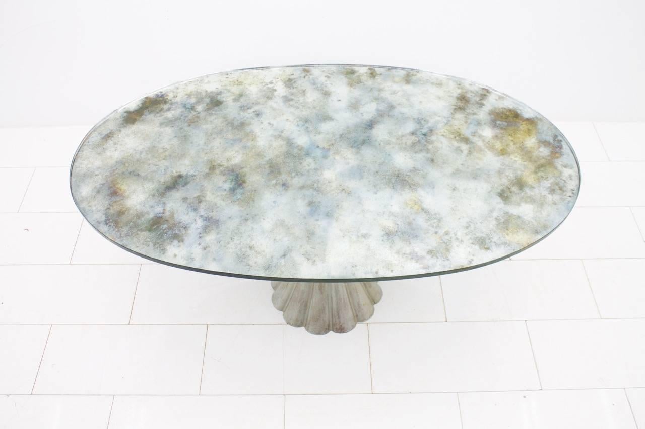 Elegant dining table with oval mirrored glass top with marble effect and metal cast foot from italy 1960s.
Measures: W 175 cm, D 105 cm, H 73 cm.
Very good condition.


