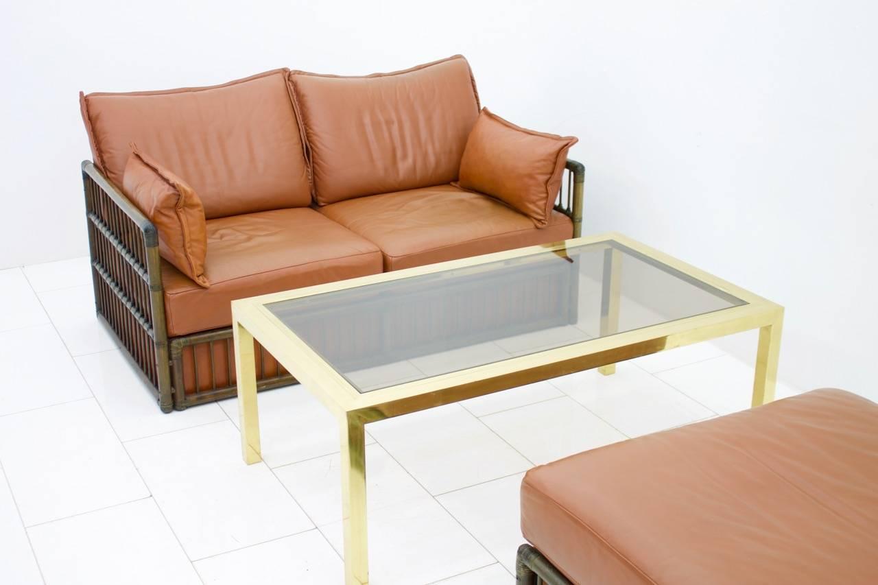 Two Person Leather Sofa and Foot Stool with Rattan In Good Condition For Sale In Frankfurt / Dreieich, DE