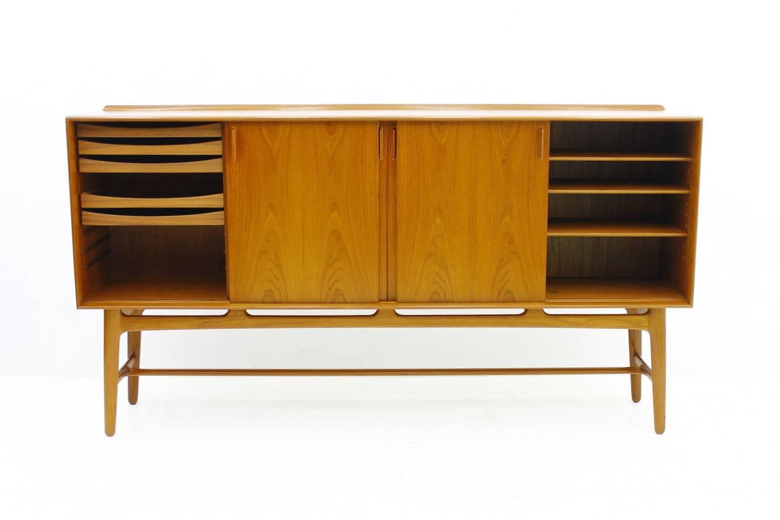 Nice Teak Wood Highboard by Svend Aage Madsen, Denmark 1960`s. Beautiful Teak Wood and fantastic craftsmanship. 

Excellent Condition.

Worldwide shipping.