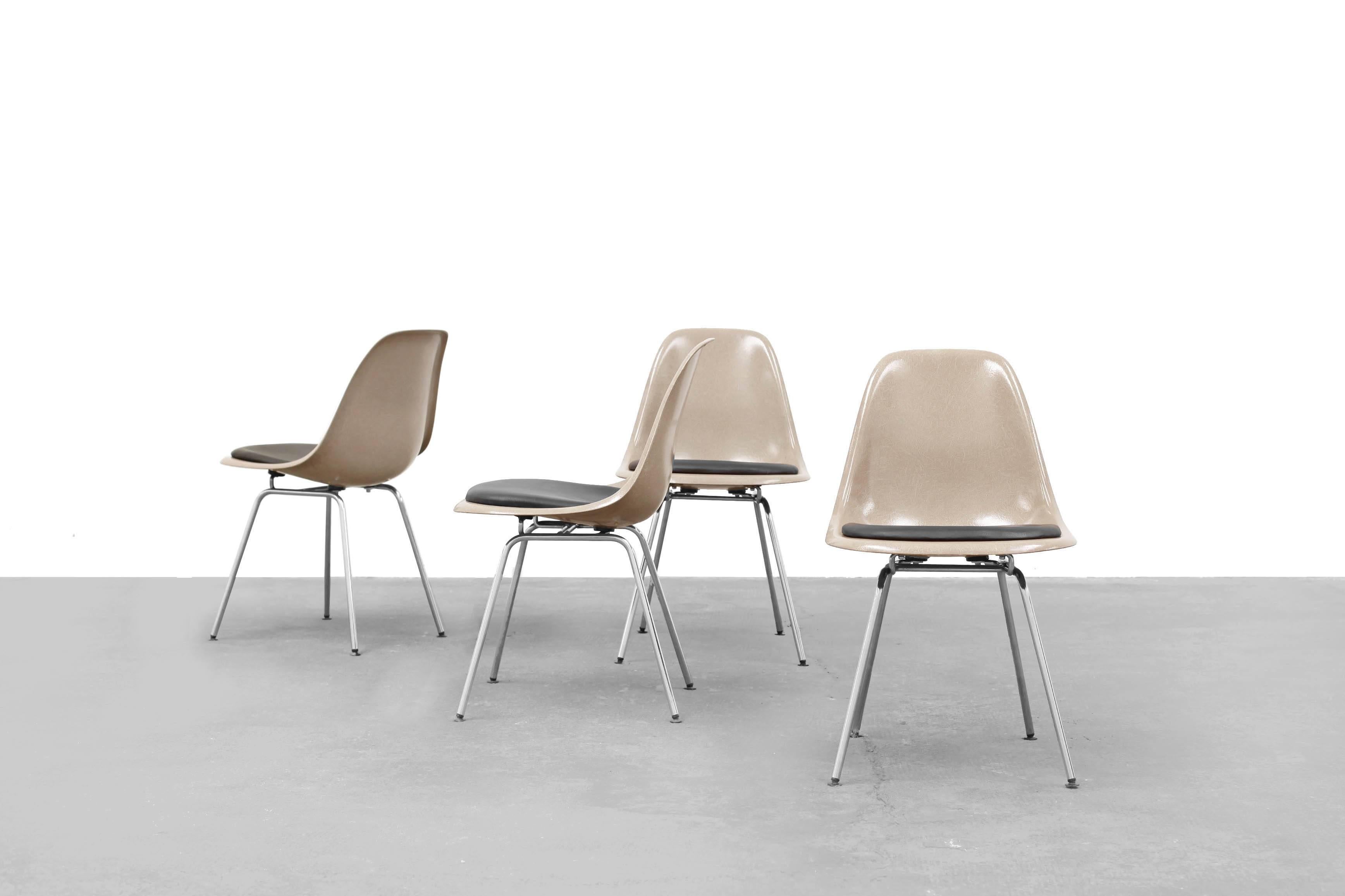 Set of four fiberglass side chairs by Ray & Charles Eames for Herman Miller.
This set in 