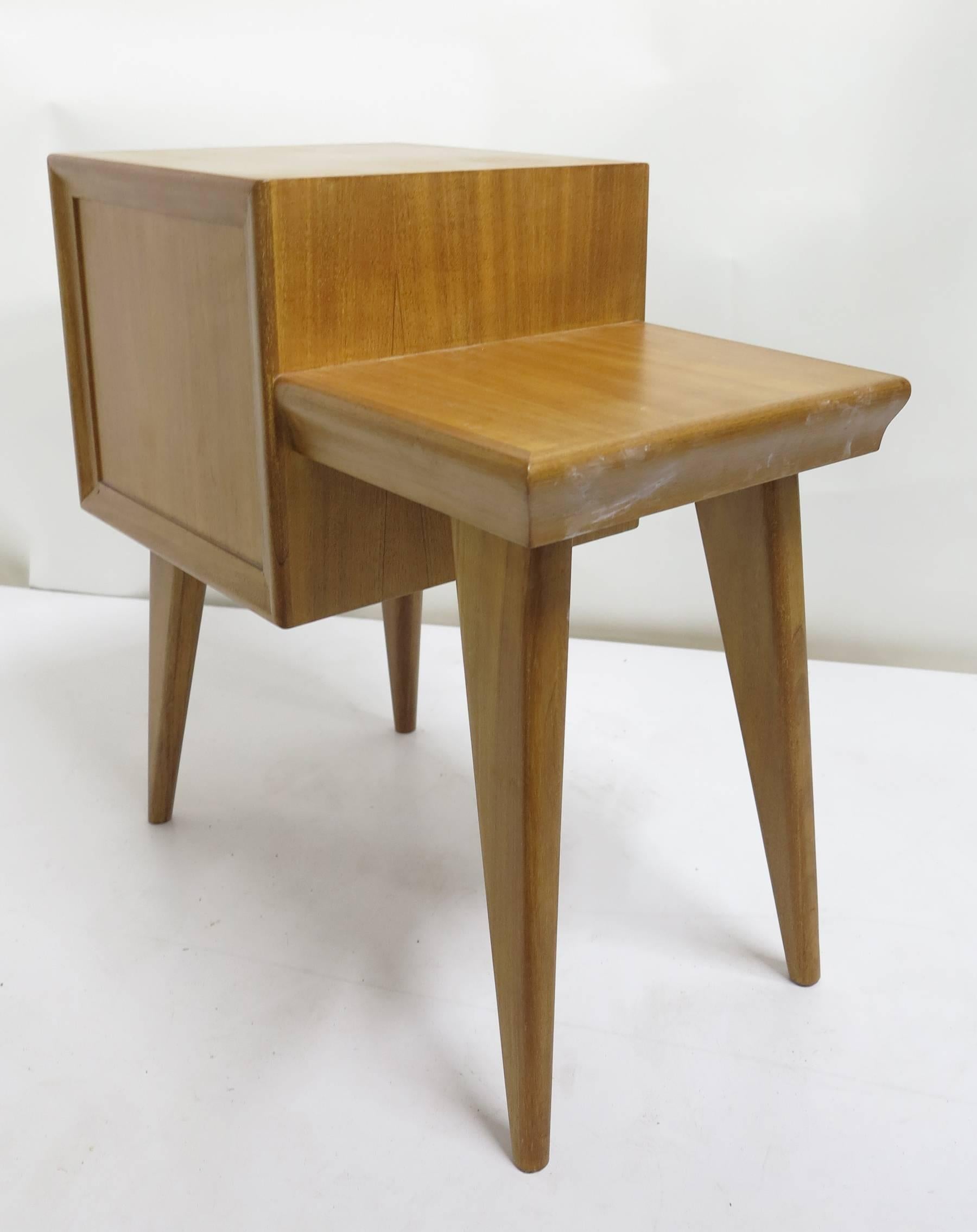 Modern style Mahogany end tables from the 1950s. Stepped designed with  cabinets on sprayed legs,