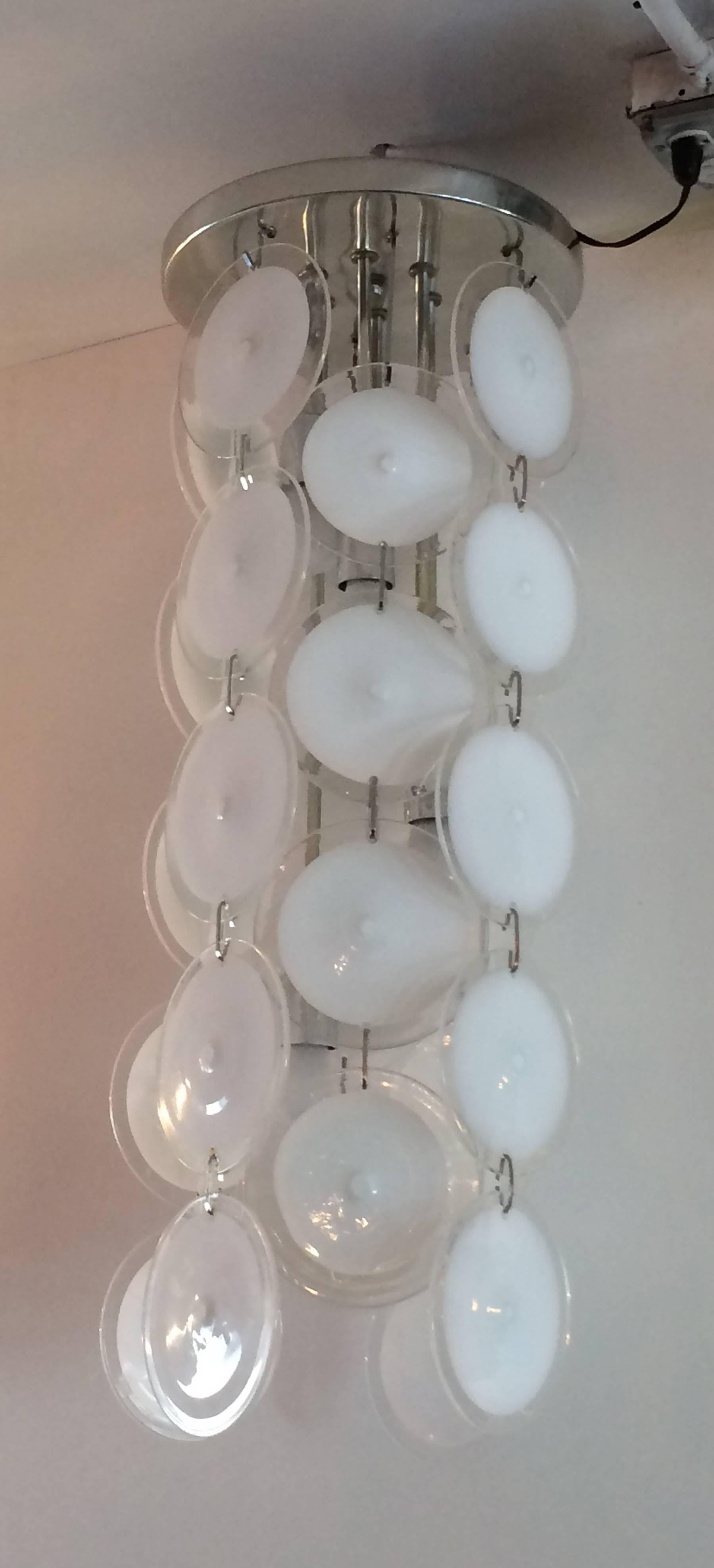 Large Vistosi light fixture with six inch white to clear discs on a chrome frame. 33 inches high with a 12 inch diameter.