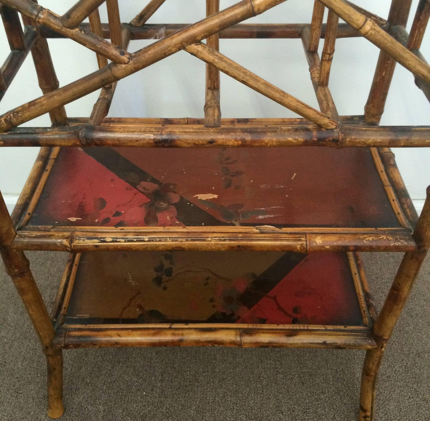 Victorian era English bamboo magazine stand. Retains original finish with original painted panels. Minor loses to finish.