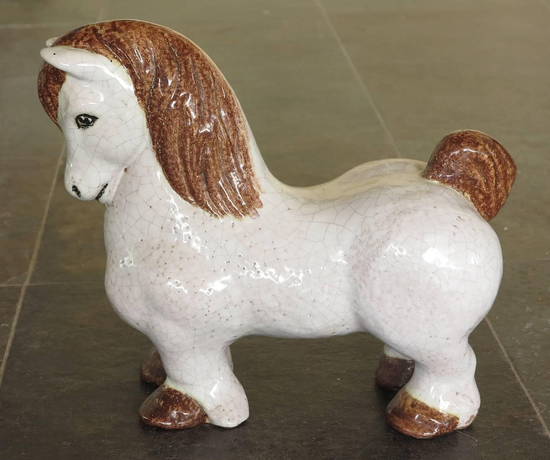 Italian Pottery Horse sculpture. White crackle glaze with brown glaze highlights.
In excellent condition.