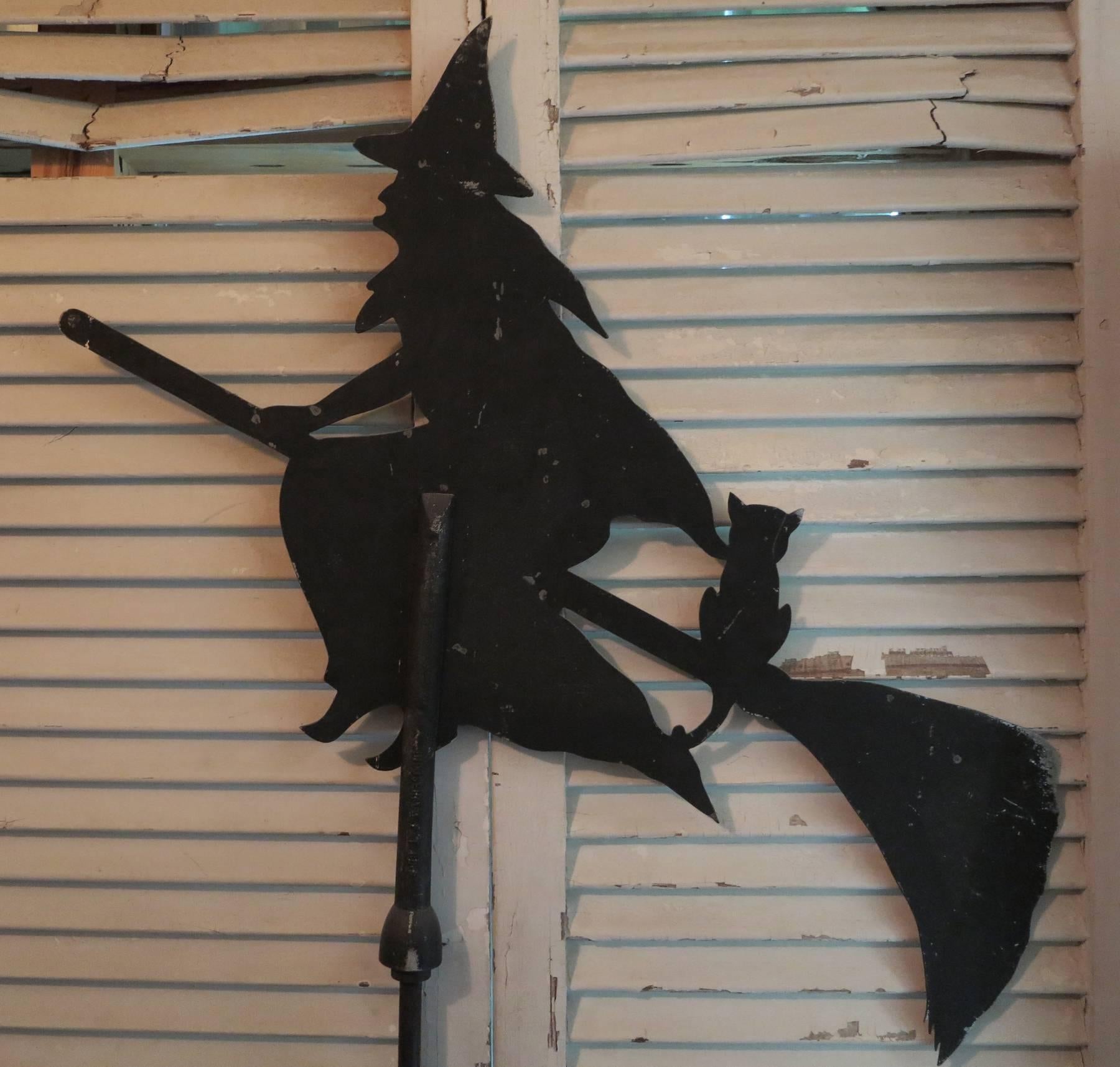 Sheet metal halloween witch weather vane. From the 1930s. The east and west arrows are missing.