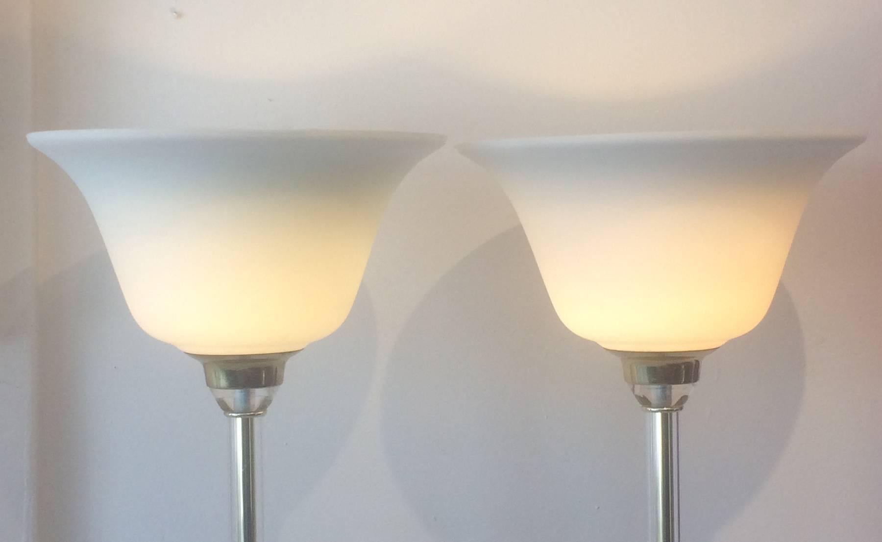 Pair of vintage floor lamps Lucite with white glass shades. Biomorphic Lucite basses with Lucite fitters and shaft, circa 1980s from a Miami Beach estate.