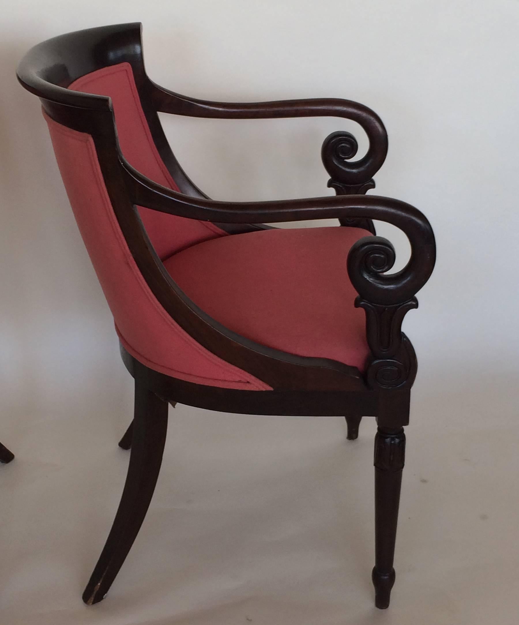 Pair of Biedermeier bergere armchairs. Craved highlights on arms and legs.