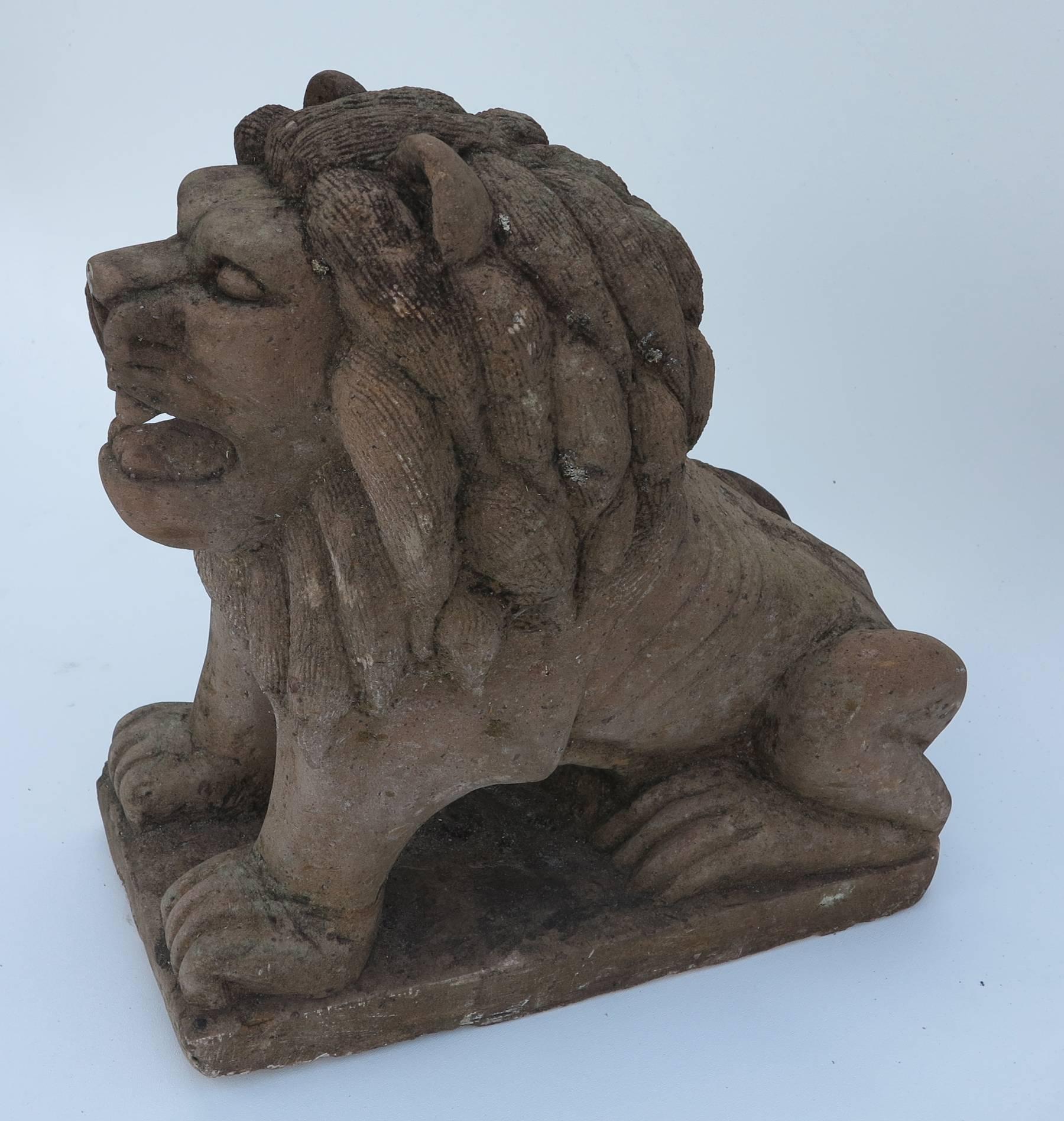 Cast cement Petite lions with terra cotta finish. Nice aged patina graceful entry lions. Small-scale. Measures: 16 wide by 16.5 high by 7.5 deep.