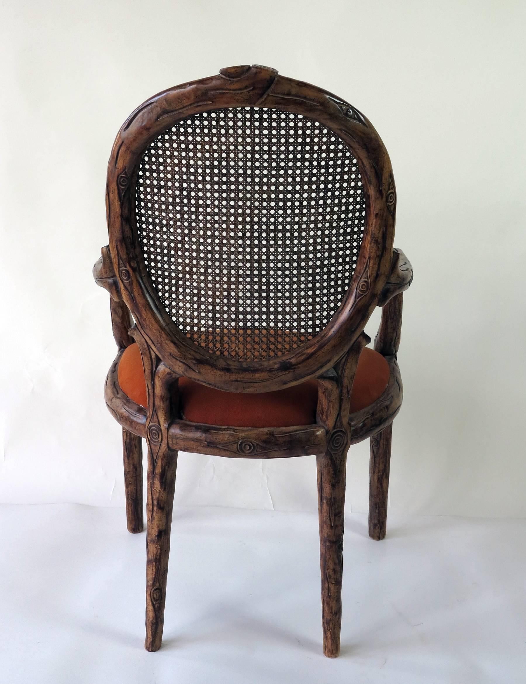 Cane back with upholstered seat faux bamboo armchair. In original condition from 1980s.