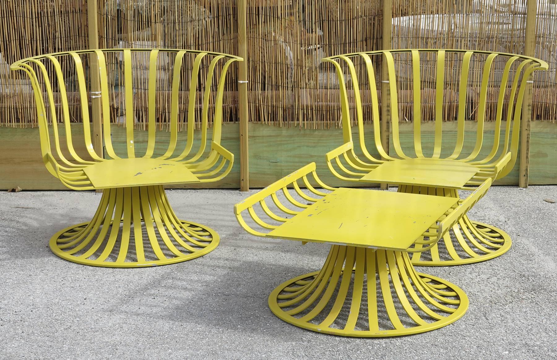 Yellow painted aluminium patio chairs by Woodard. Some loses to yellow paint. Upholstered with bark cloth fabric in good condition.
 