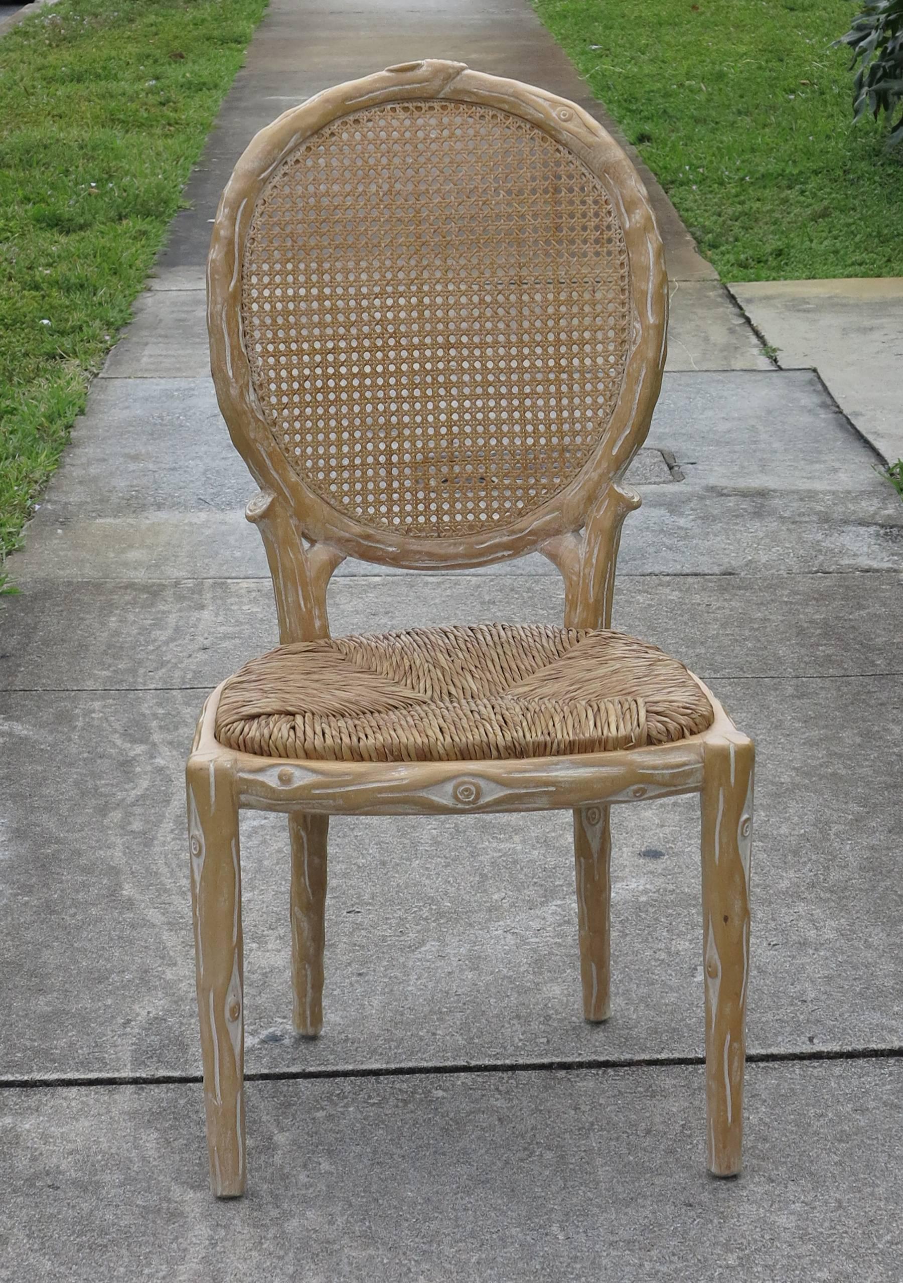 Four vintage dining chairs, four chairs with caned backs and rush seats.
Faux Bois carved twig dining chairs. Natural original finish in excellent condition. No damage to seats or backs.