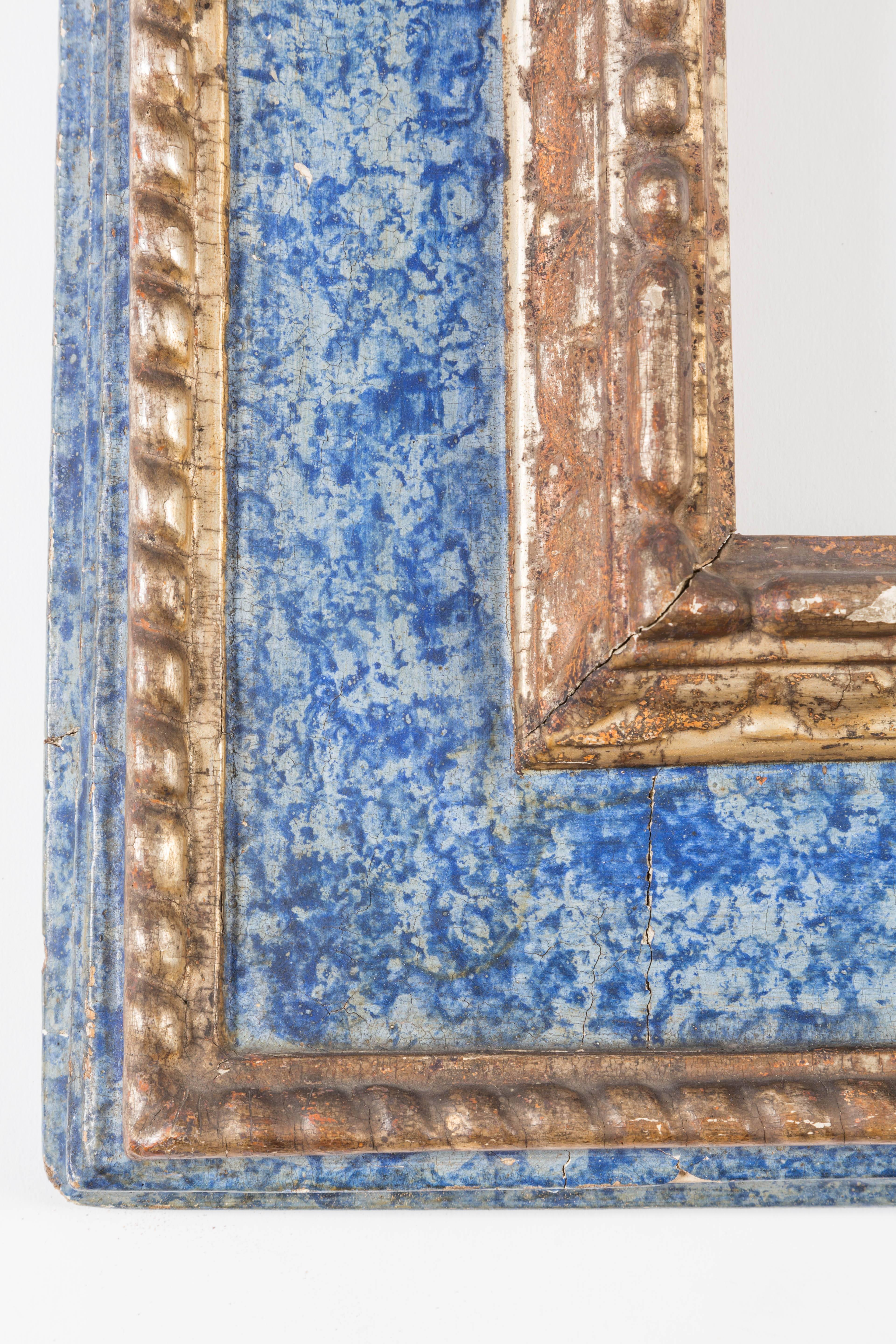 Beautiful lapis Italian mirror, silver gilded.
This is a beautiful example of a cassetta frame.
Original hardware.