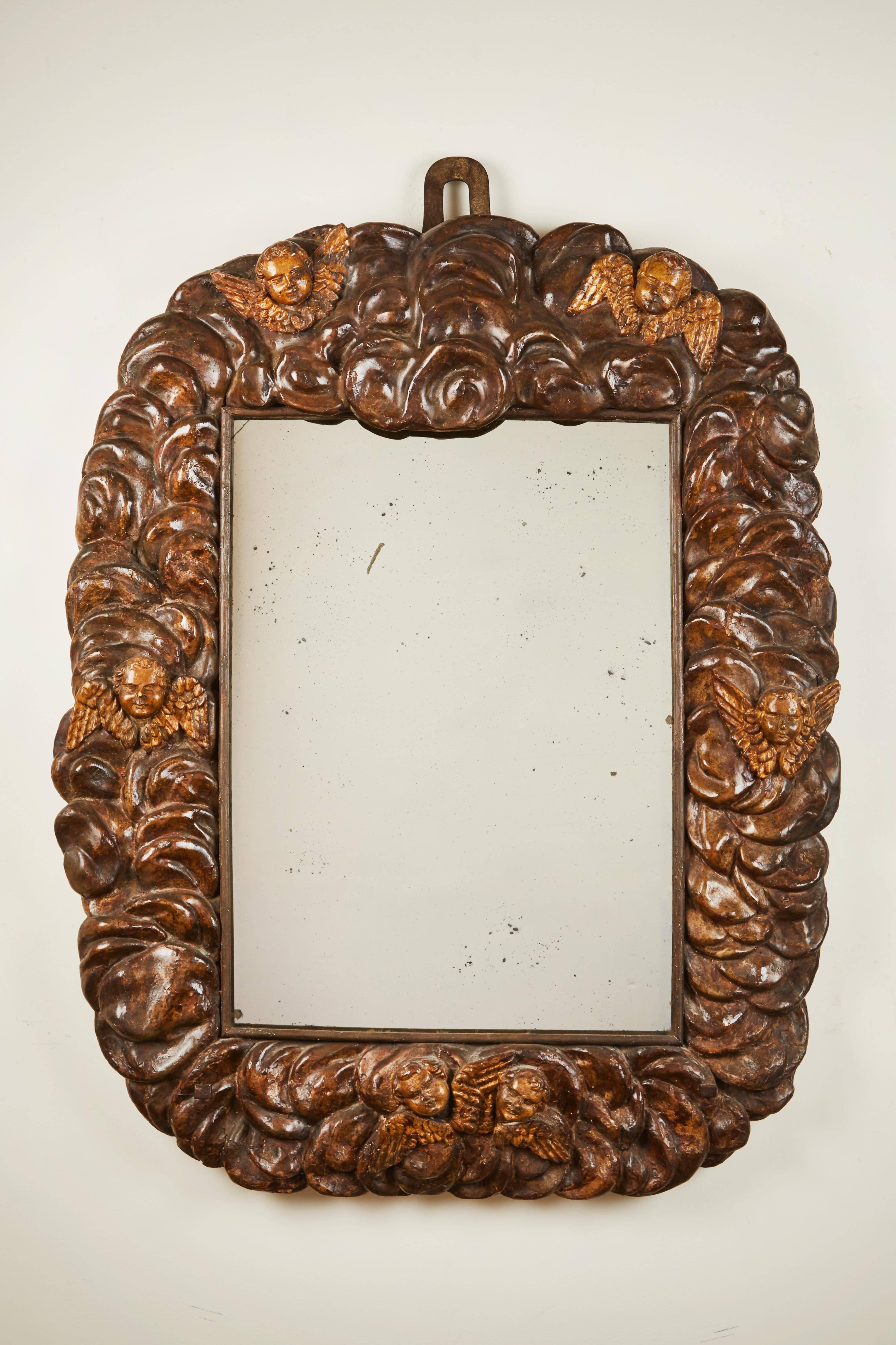An extraordinary carved Italian polychrome mirror. Original candleholders can be removed as depicted in the picture. 
A late 17th century Italian mirror, most likely from the Lombardy area.
The central mirror was added around the turn of the late