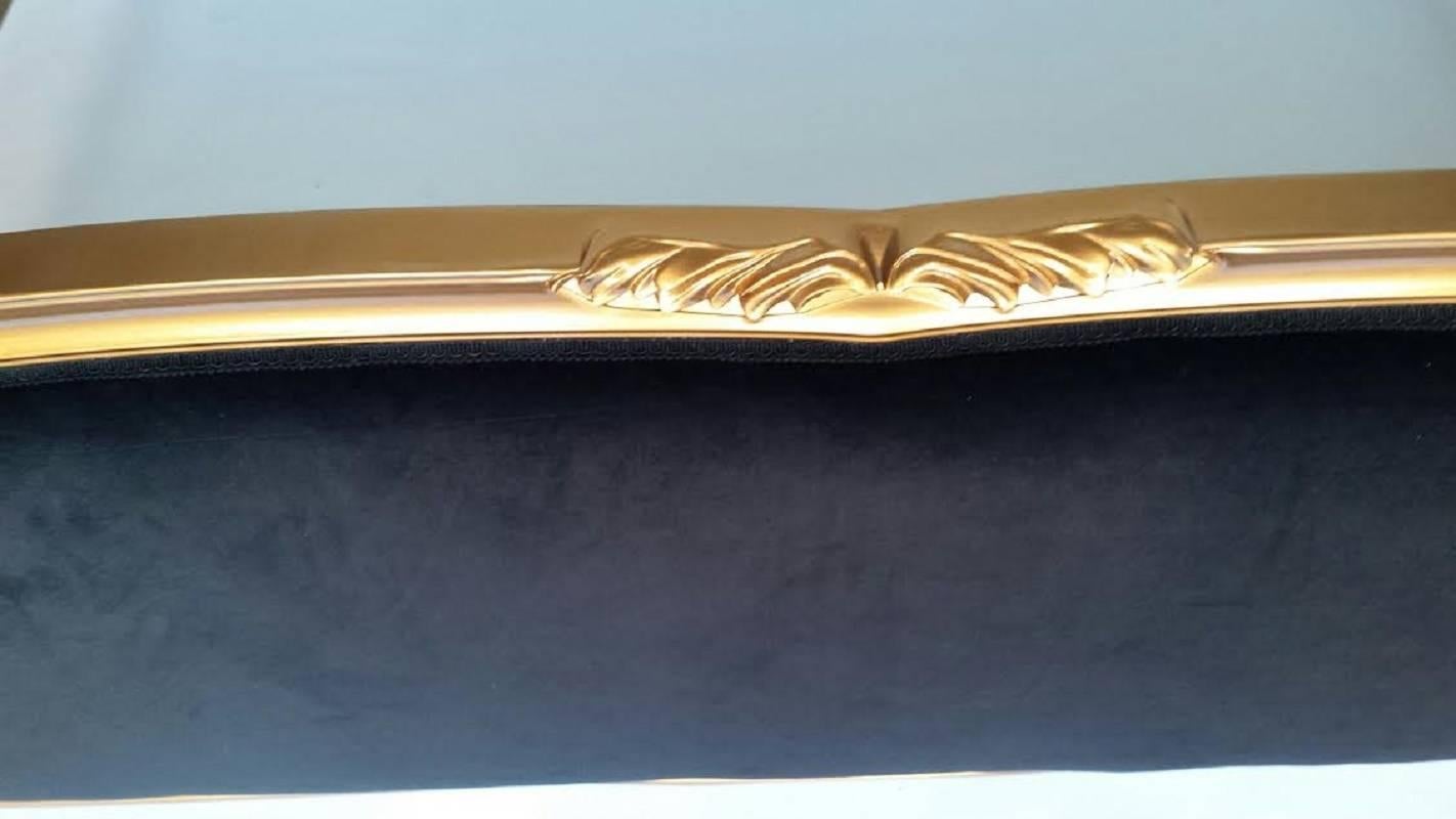 French Louis XV style king-size bed frame. Newly upholstered in black velvet and finished in gold. The bed comes with center supports and slats, not shown in the photos.