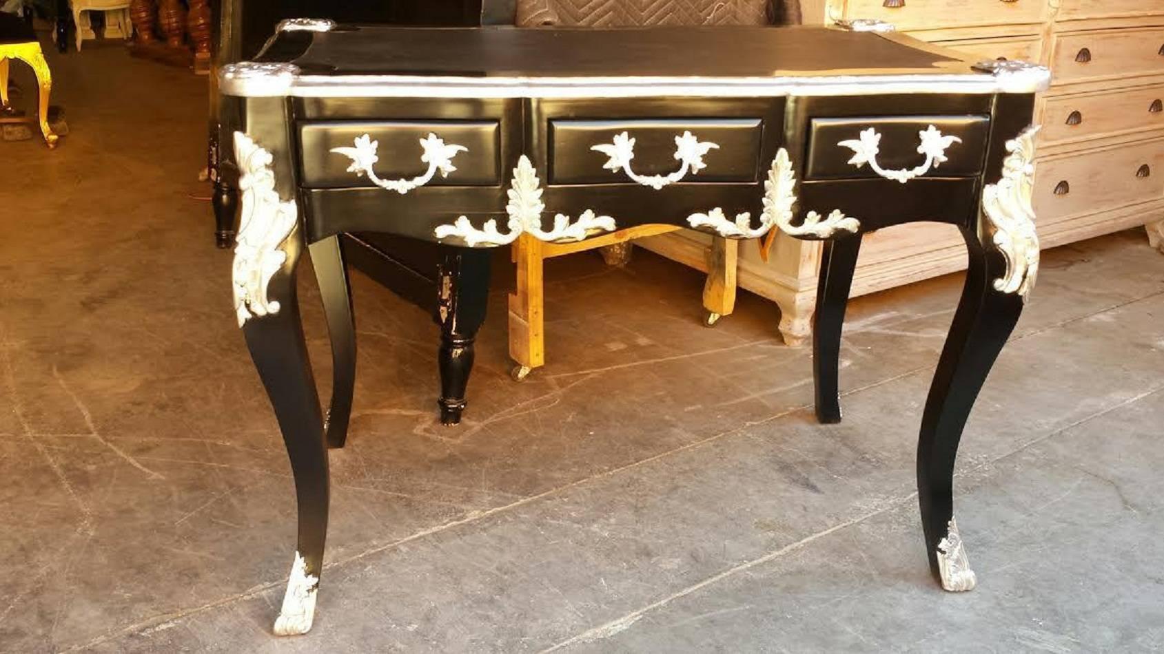 French style, black and silver desk is timelessly chic. This desk features a dramatic black and silver finish, leather top, (perfect for scribbling those handwritten notes!), and three front drawers.