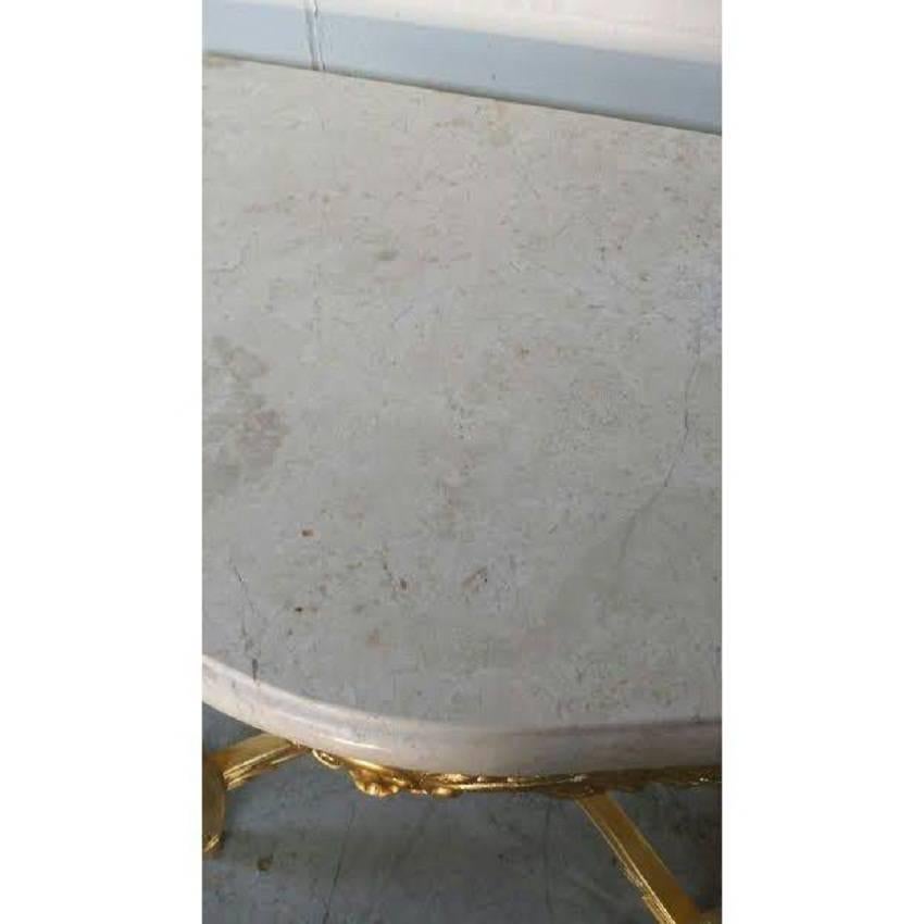 French Rococo XV style white marble-top console or side table. Made of solid wood and finished in gold leaf.