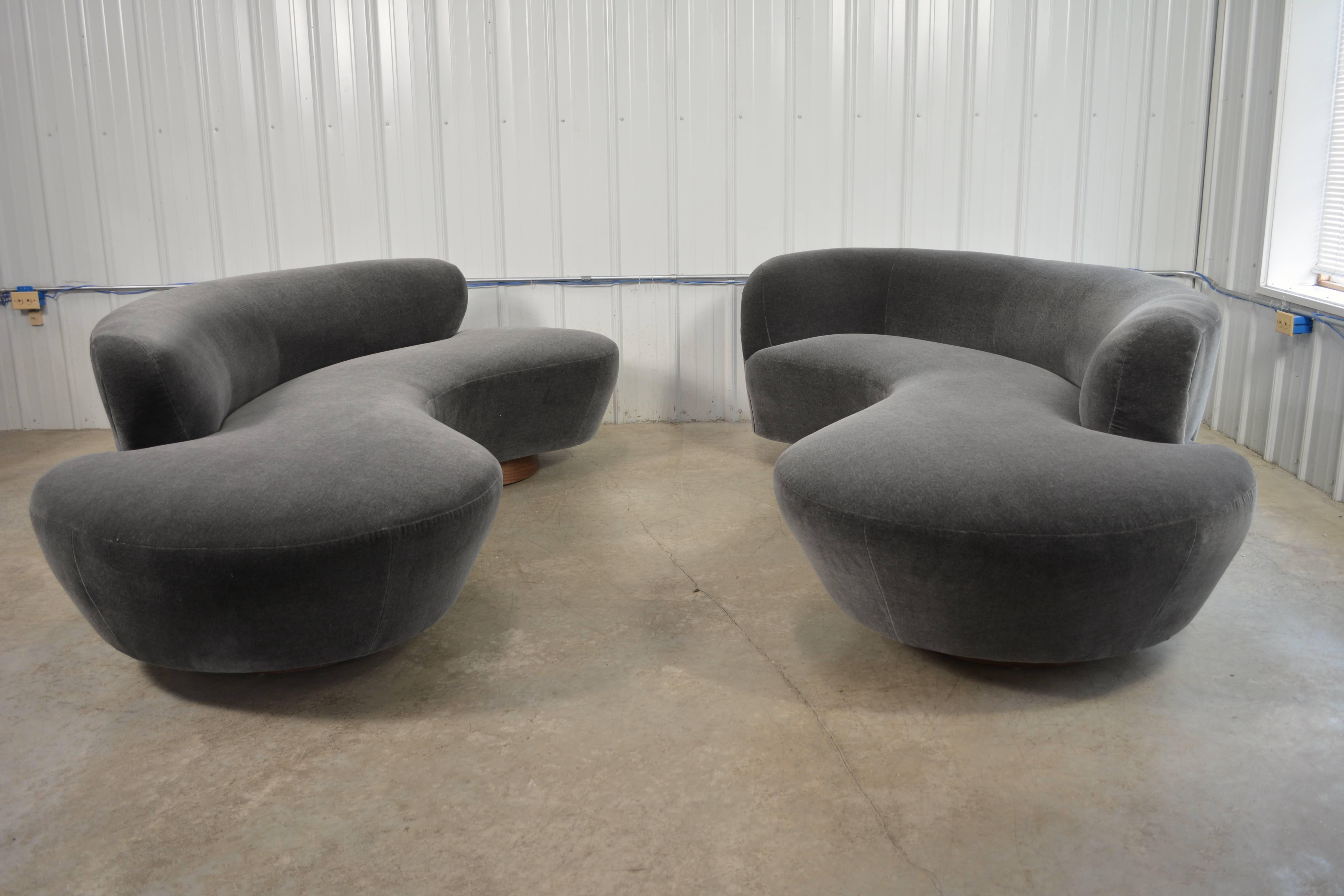 Sofa designed by Vladimir Kagan for Directional. Circular walnut plinth bases. Newly recovered in mohair. Lucite support plate. Directional label. Fabric samples available. A second sofa is available.