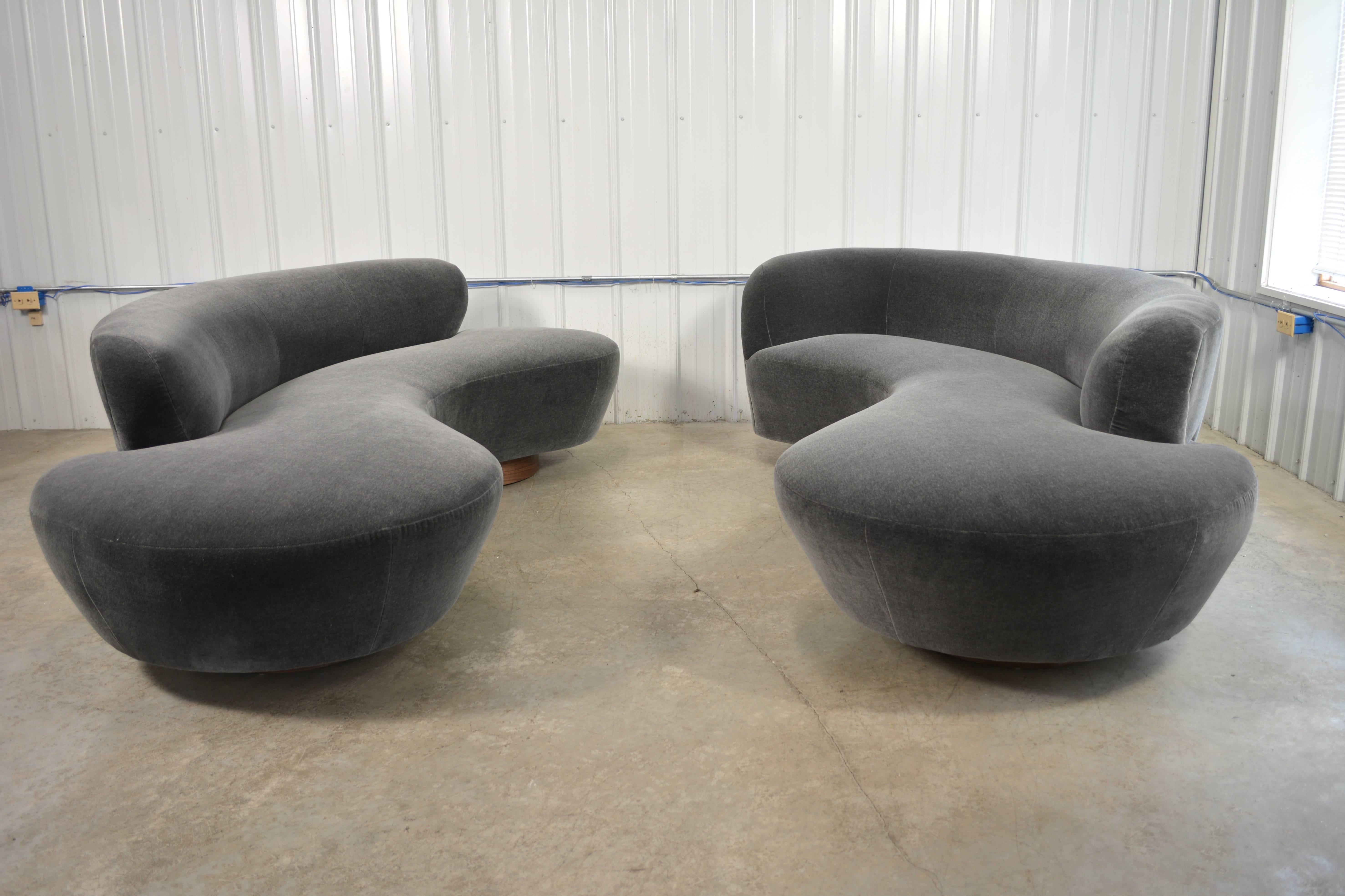 Sofa designed by Vladimir Kagan for Directional. Circular walnut plinth bases. Newly recovered in mohair. Lucite support plate. Directional label. Fabric samples available. A second sofa is available.
