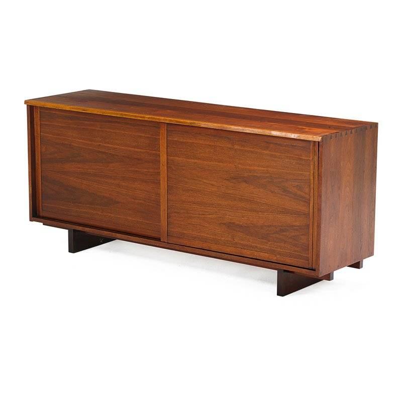 George Nakashima credenza. Walnut construction. Live front edge. This piece can easily function as a dresser, as well. A copy of the original drawing is included. Signed with client's name.