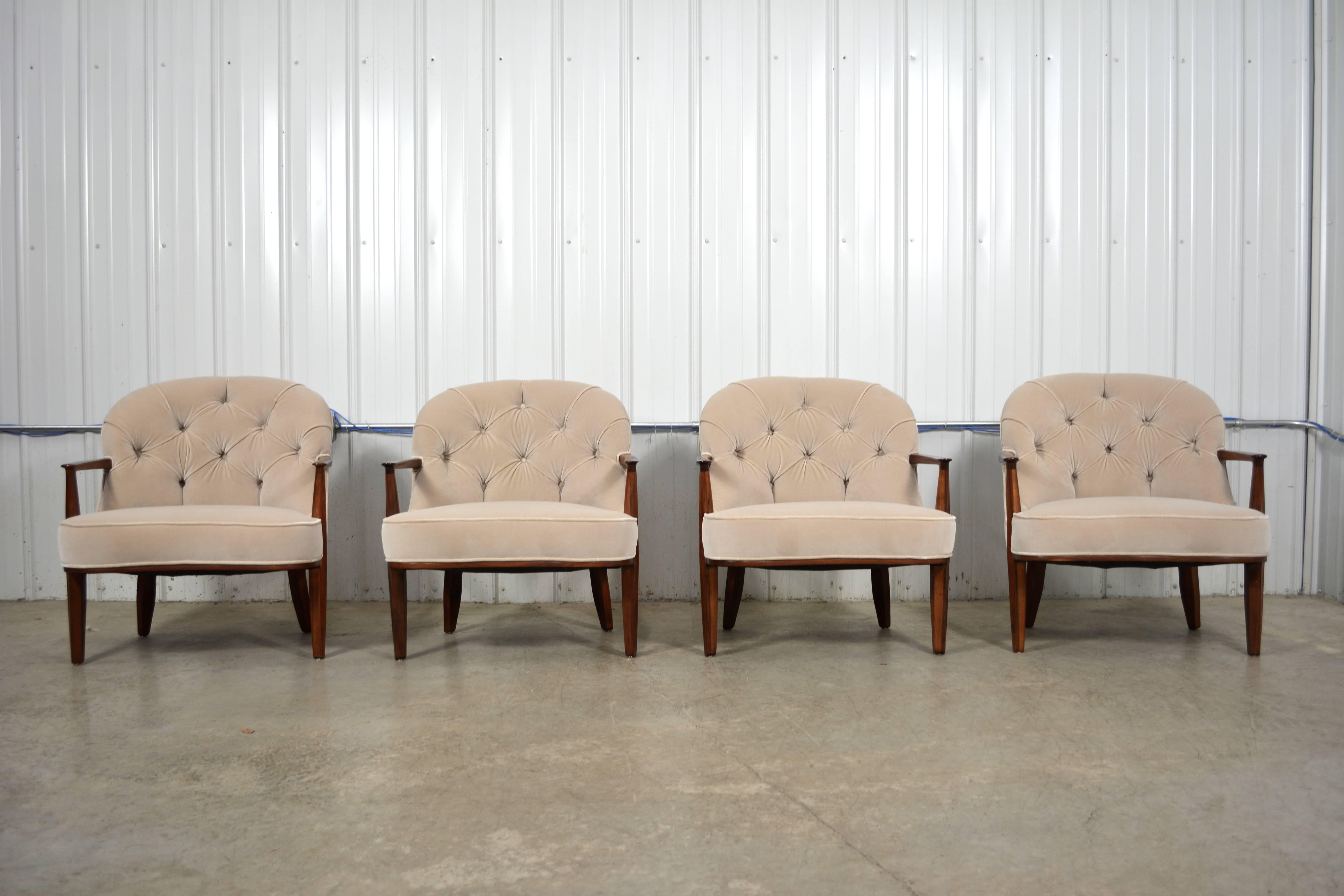 A remarkable set of four Janus lounge chairs by Edward Wormley for Dunbar.  Sculptural, solid wood frames.  Round, tufted backs.  Newly refinished and recovered in Italian velvet.  Fabric samples available upon request.