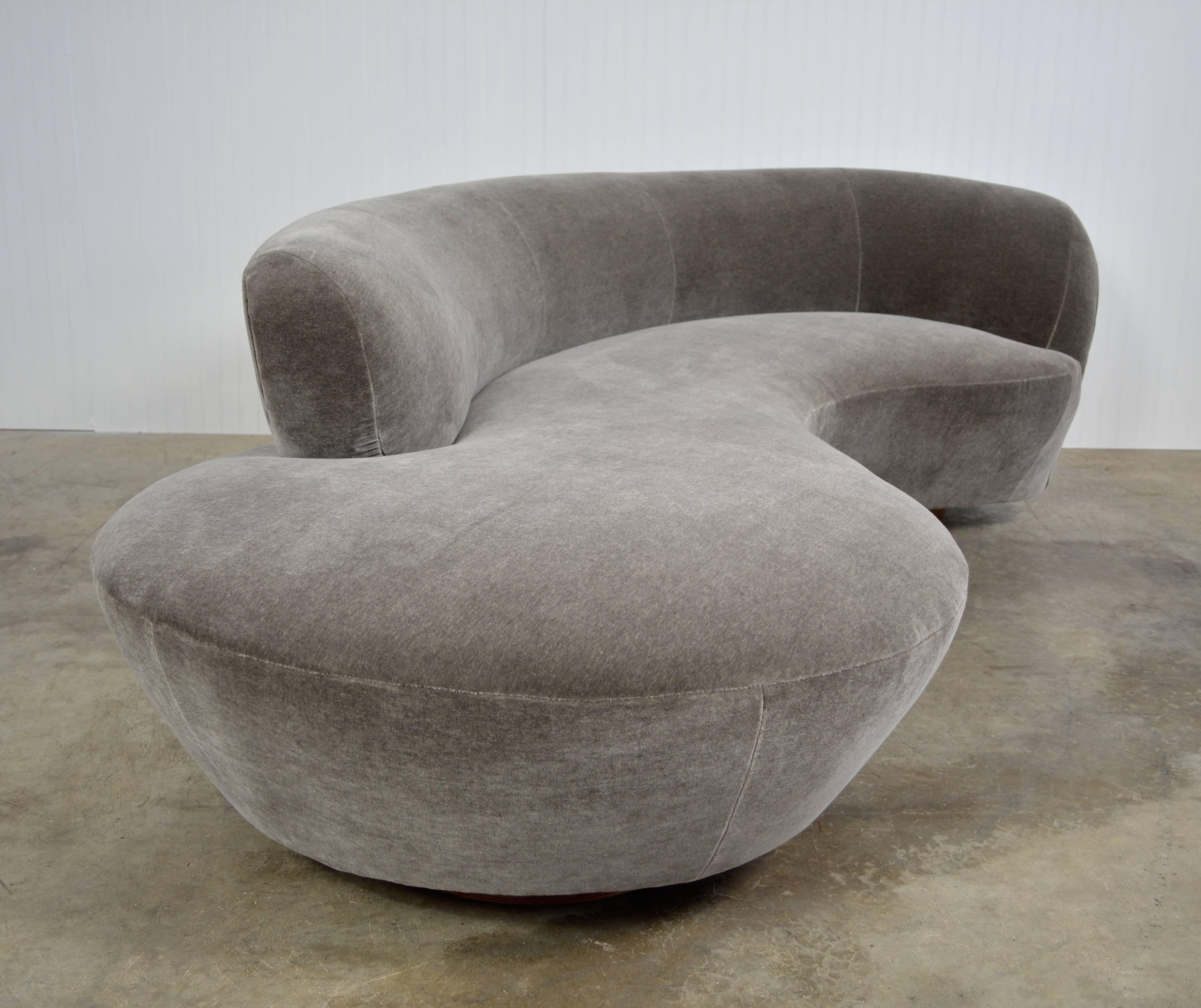 Vladimir Kagan sofa designed for Directional. Newly recovered in grey mohair over walnut bases. Lucite support place and Directional label present.