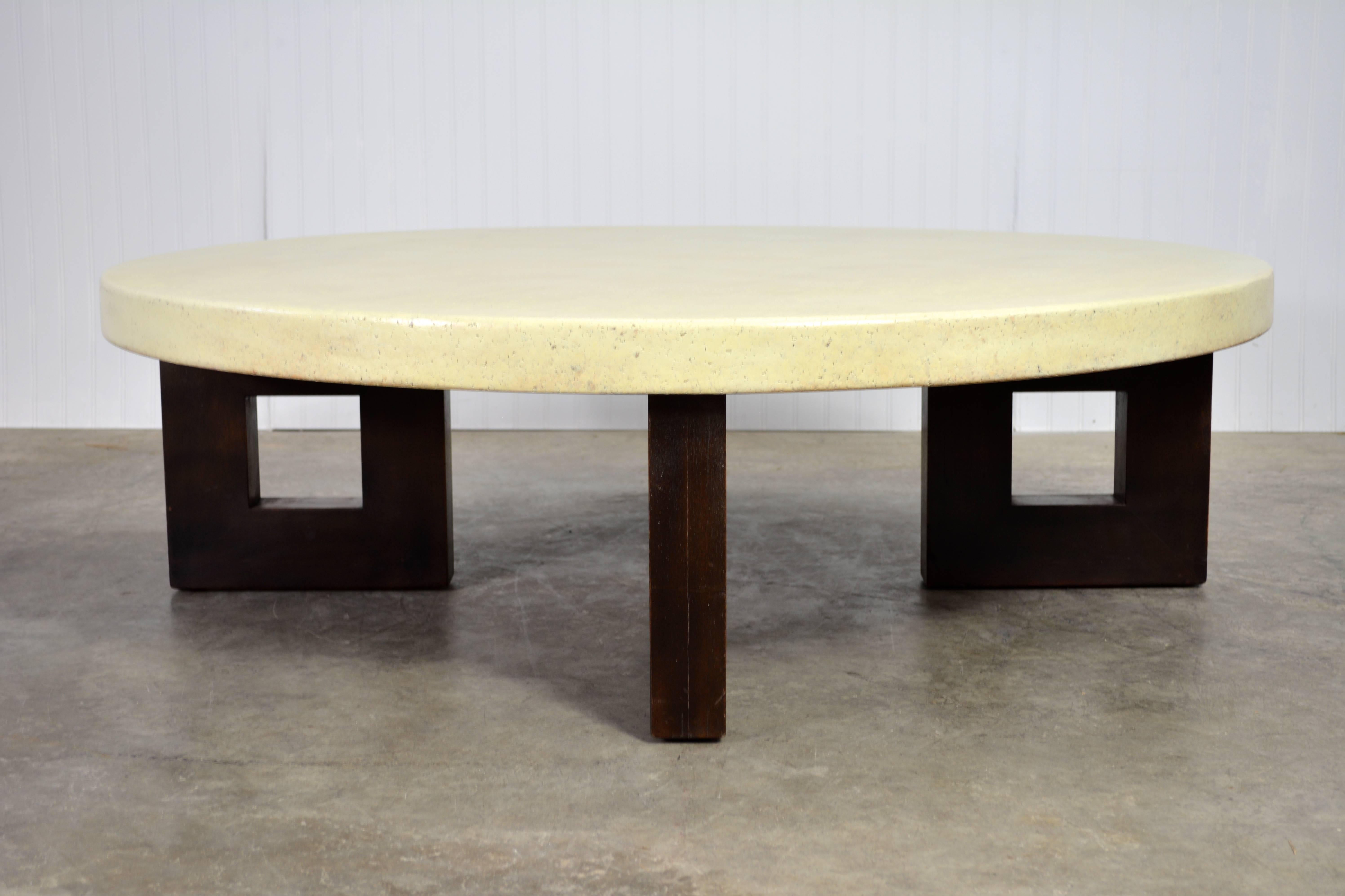 Paul Frankl designed coffee table for Johnson Furniture Co. Round cork top supported by mahogany legs.