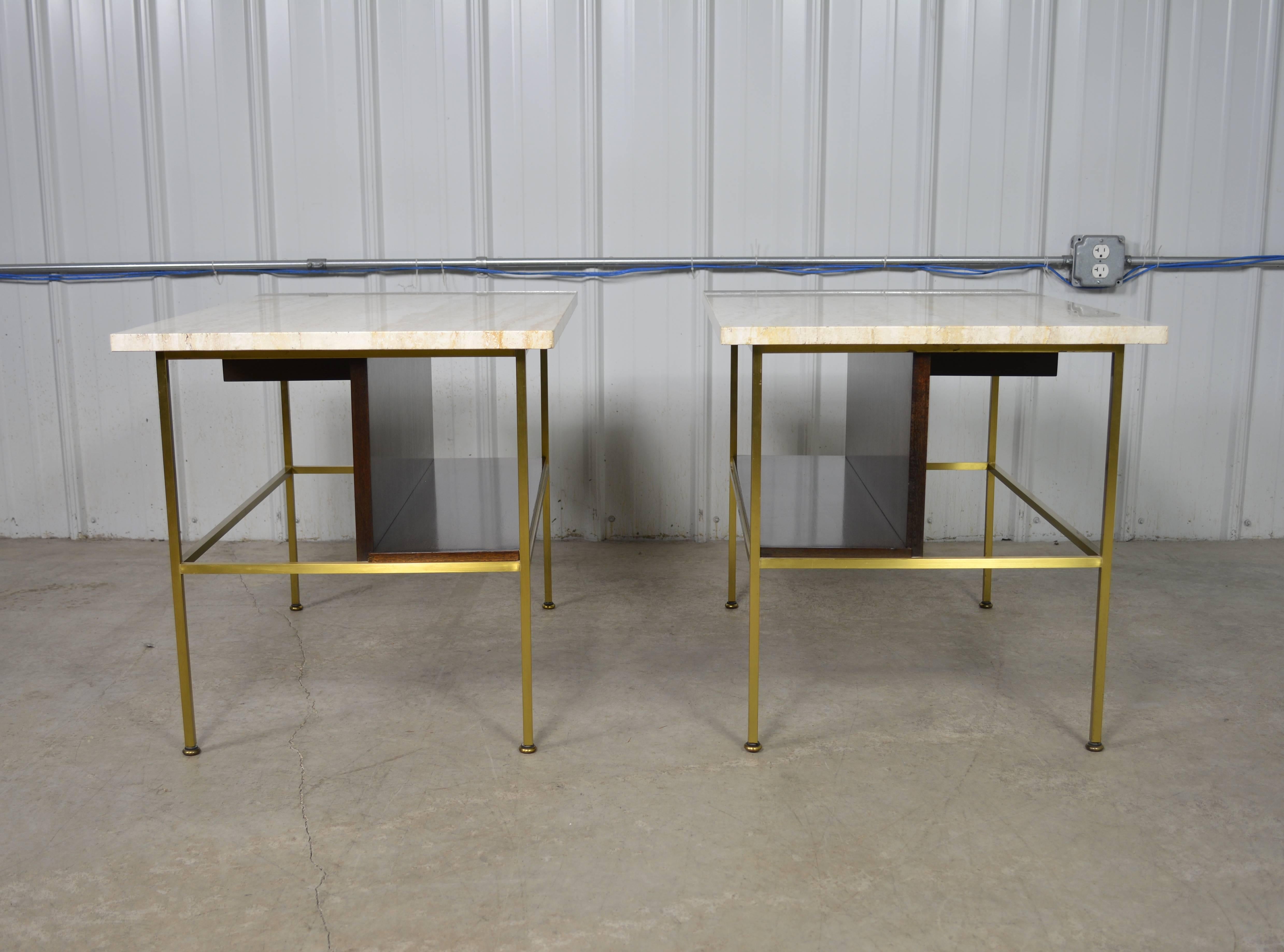 A pair of Paul McCobb travertine top end tables designed for 