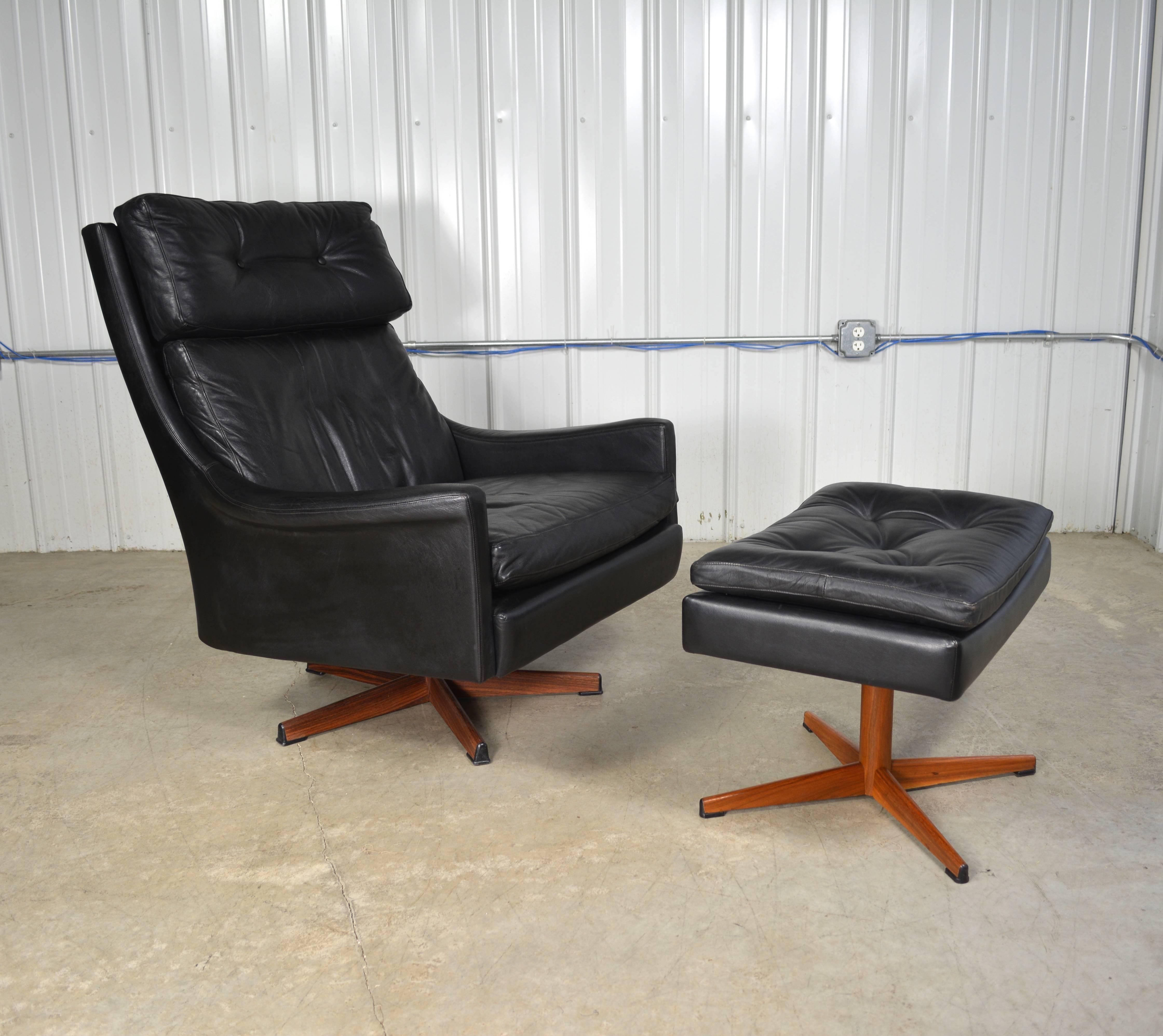 A generously scaled lounge chair and ottoman designed by Ib Kofod-Larsen for OPE.  Original leather upholstery and teak bases.  The chair swivels 360 degrees.  Very comfortable!  Ottoman measures 18