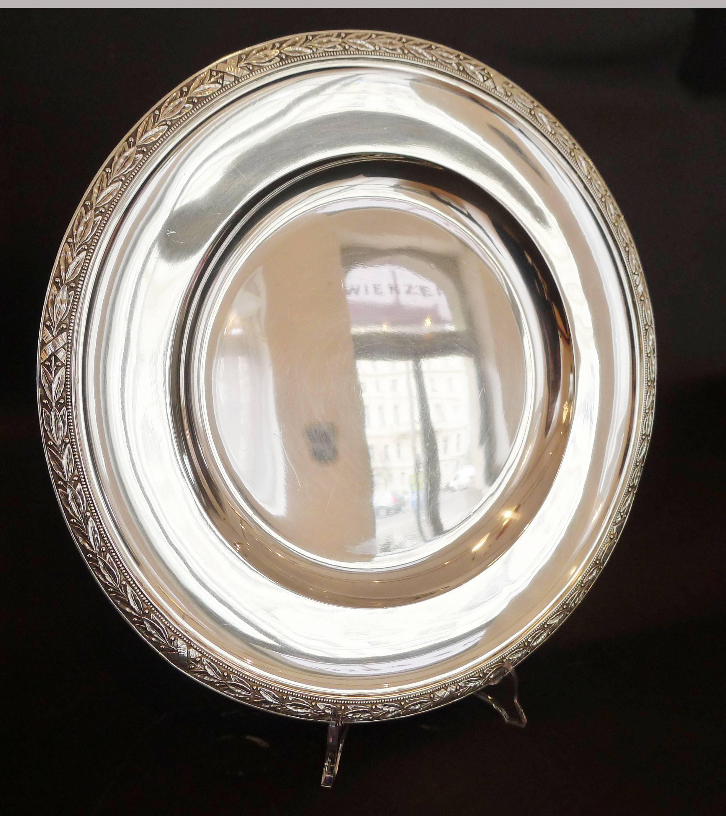 Beautiful silver plate with floral decoration on the edge made by famous Austrian designer Joseph C. Klinkosch who is well-known for his timeless and elegant designs as well as highest craftsmanship.