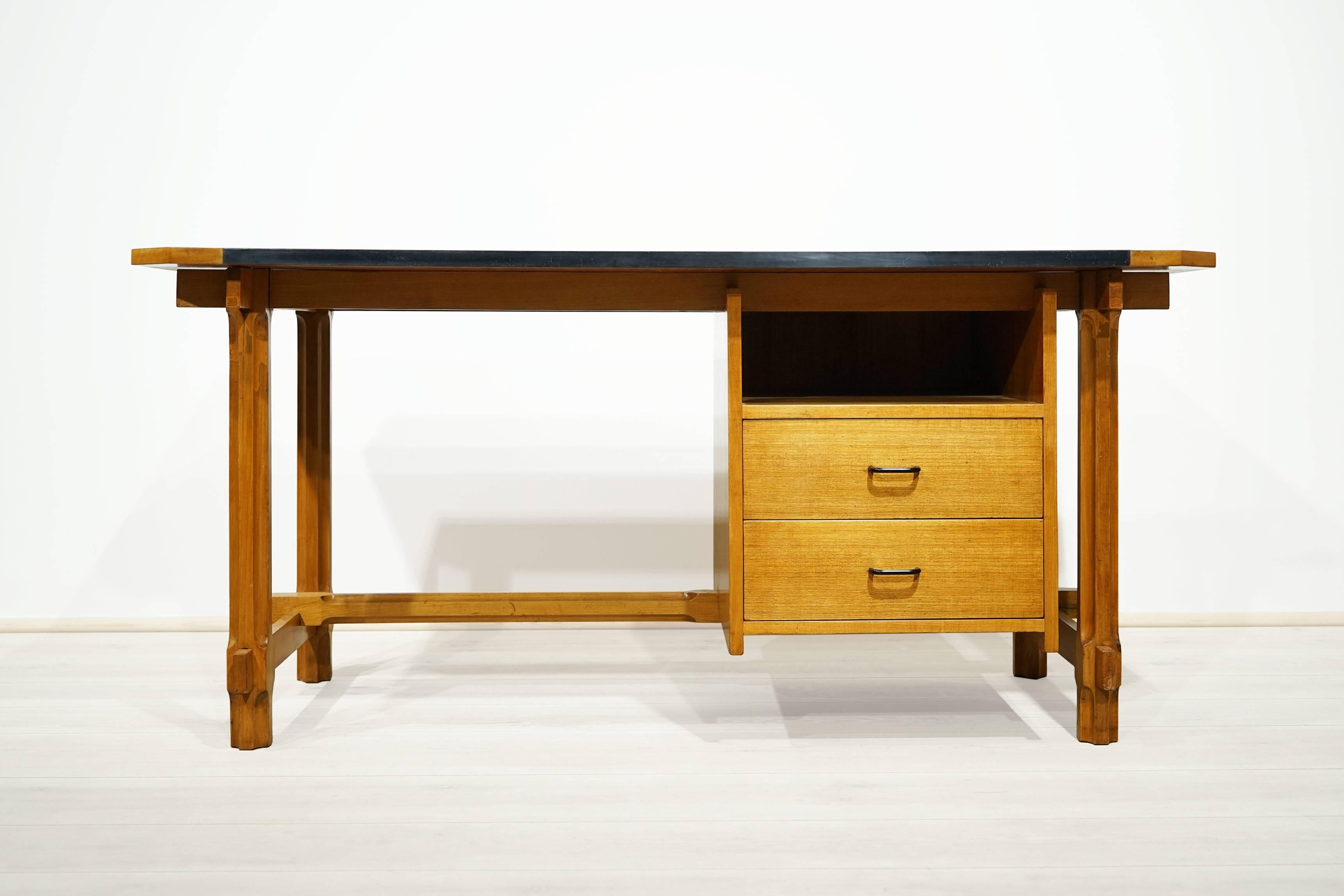 The desk is designed by Ico Parisi, manufactured by Fratelli Rizzi, Cantù 1959