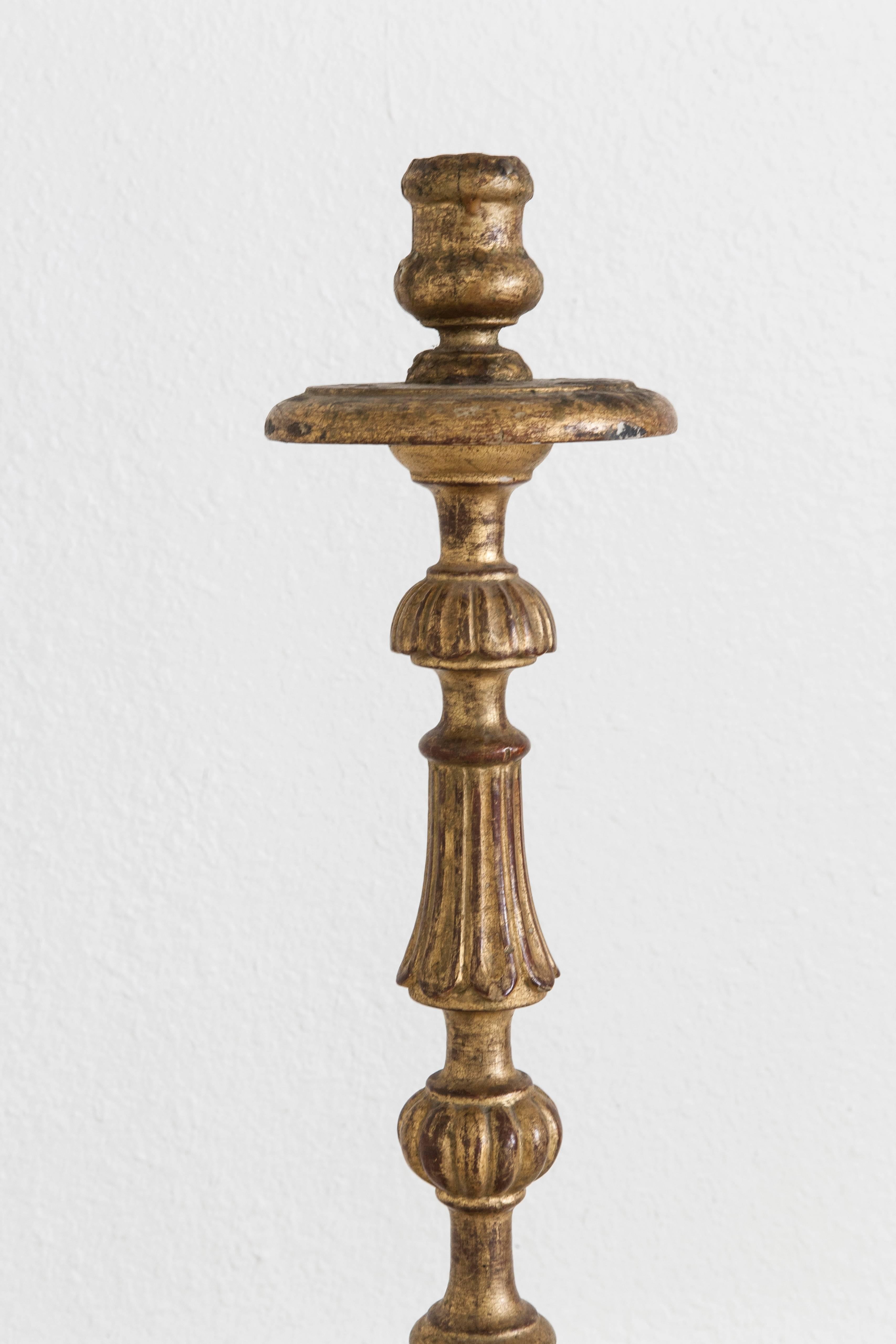 In fantastic original condition for its centuries of age, this hand-carved giltwood pricket or candlestick features an elegantly simple motif of scrollwork. Originally this piece was used on the altar of a private chapel in a chateau. Its lovely