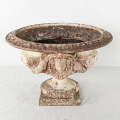 Grand Scale 18th Century French Cast Iron and Stone Urn with Neoclassical Faces