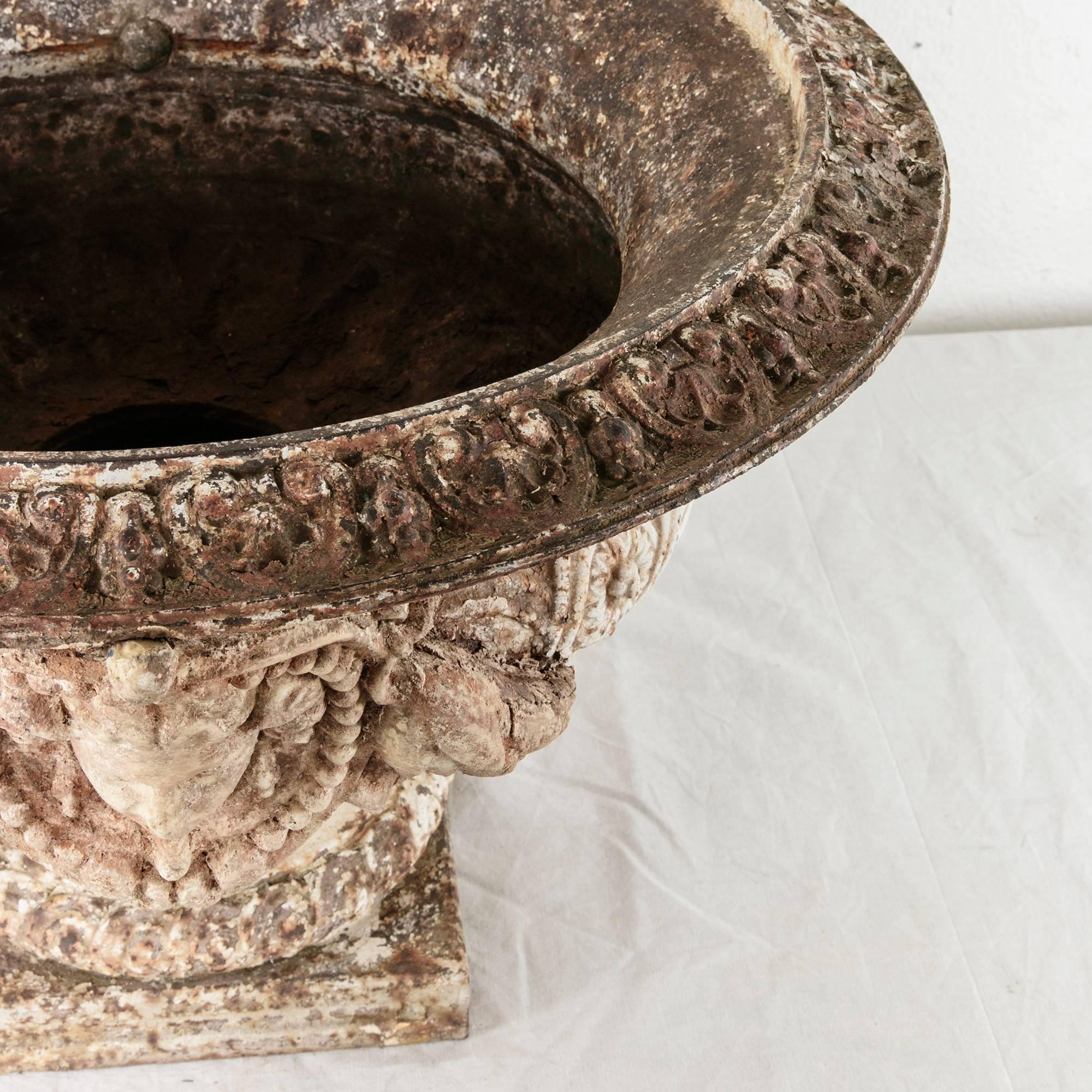 Grand Scale 18th Century French Cast Iron and Stone Urn with Neoclassical Faces 4