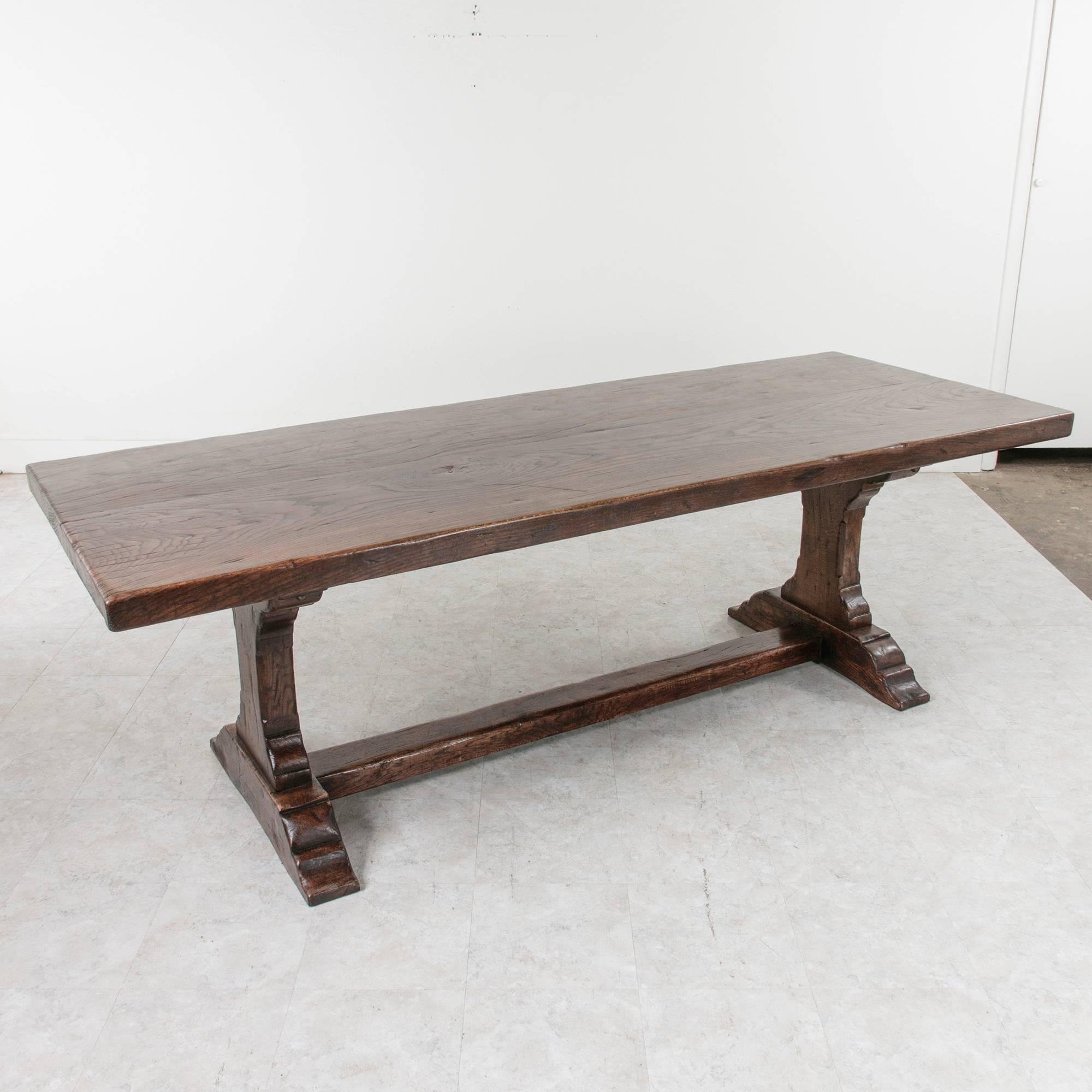 This impressive large hand pegged oak monastery table features a top made of two single 2 1/2