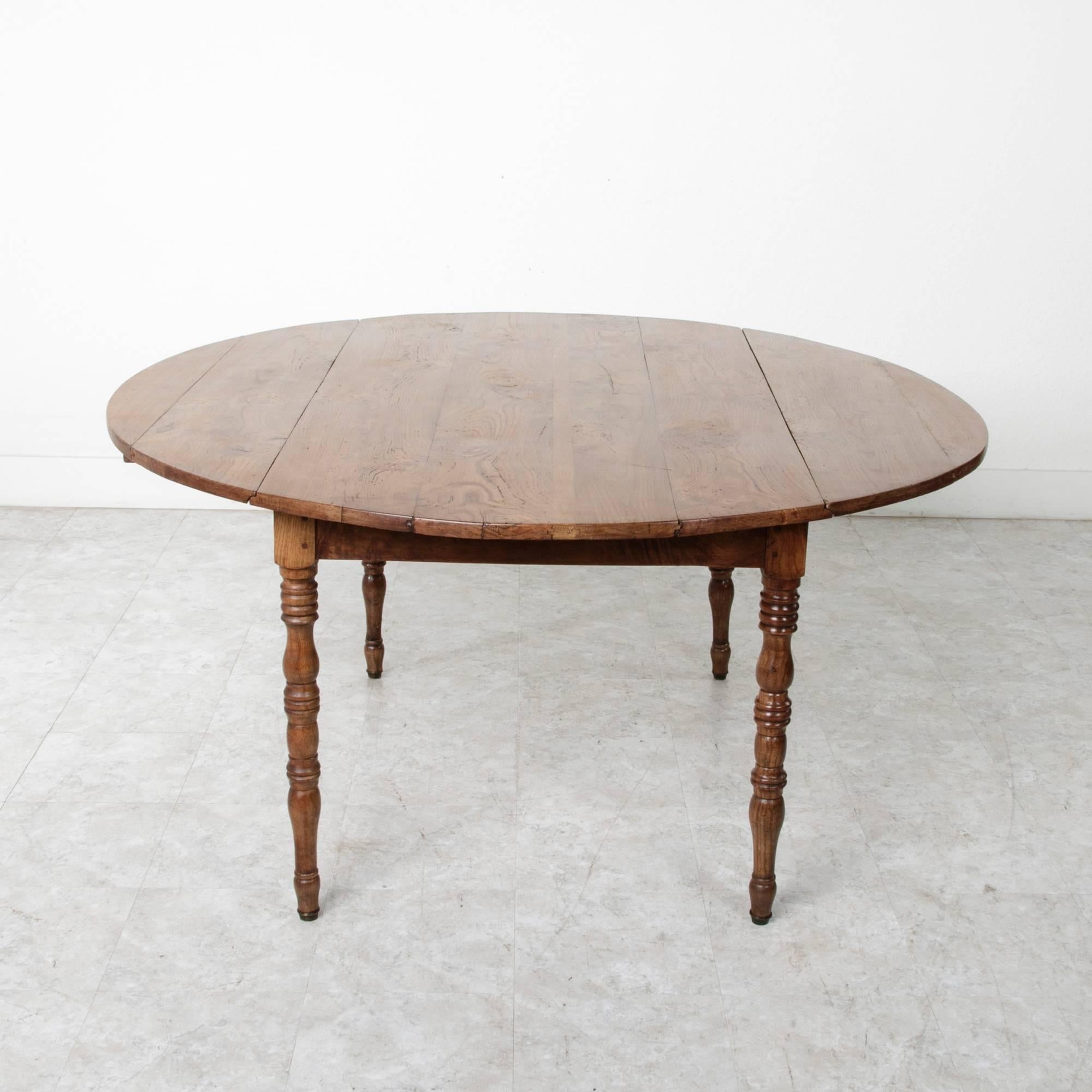 19th Century French Solid Elm Round Dining Table with Drop Leaves In Excellent Condition In Fayetteville, AR