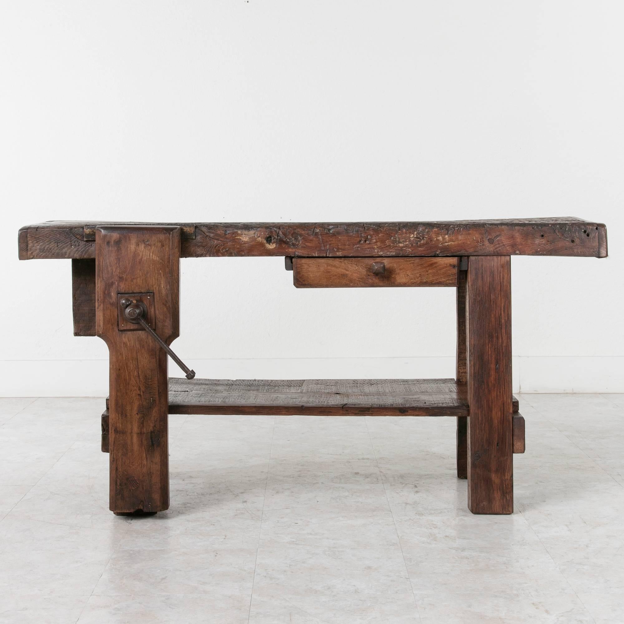 This 19th century oak workbench features a 3