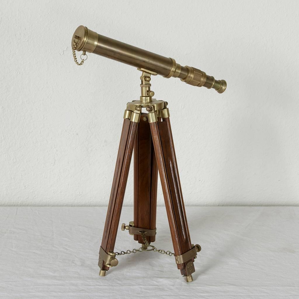 From a time when scientific instruments were built to be beautiful as well as functional, this mahogany telescope was originally used as a tabletop piece. Its tripod base has retractable legs allowing it to be portable as well as adjustable from