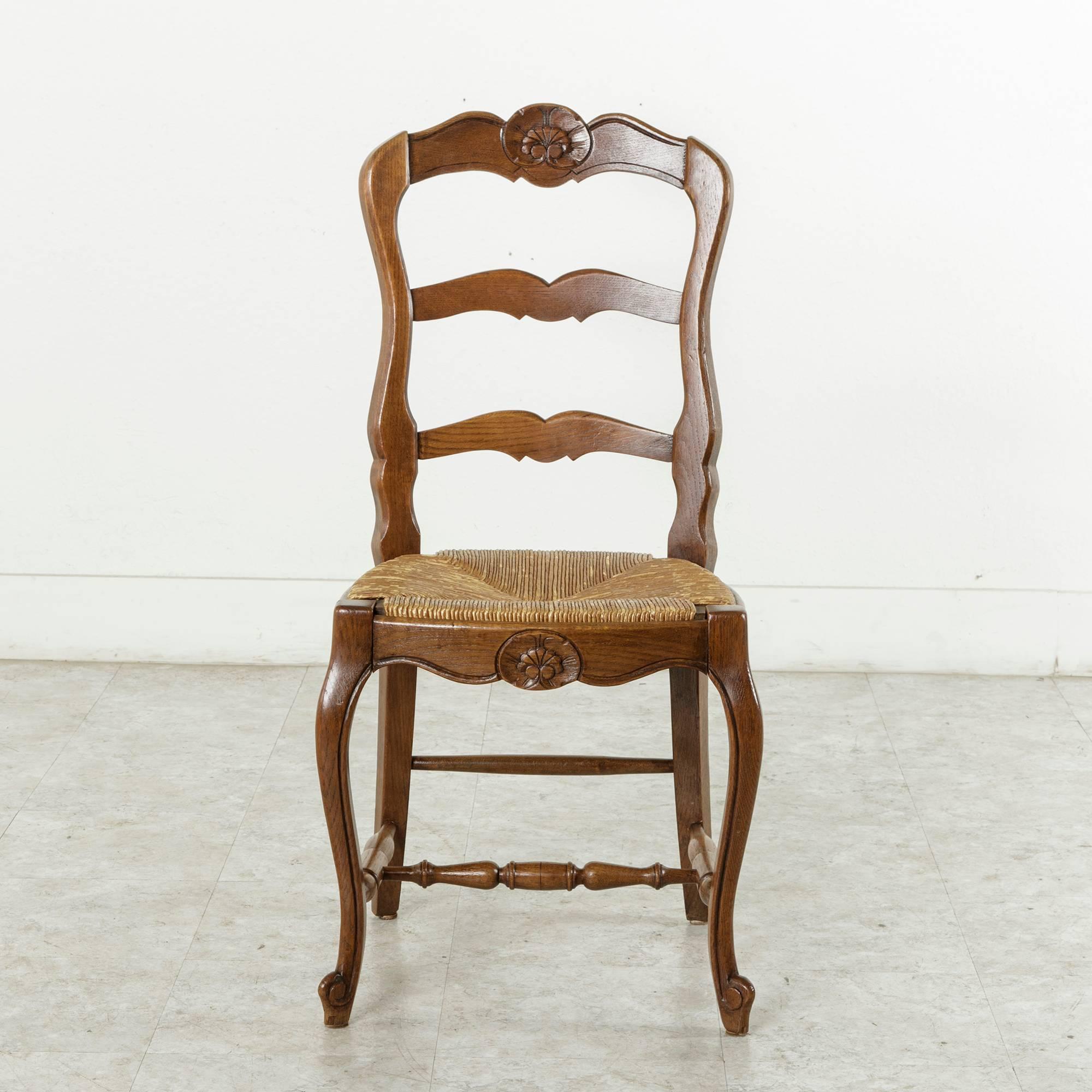 Mid-20th Century Set of Four French Louis XV Style Carved Oak Chairs with Rush Seats