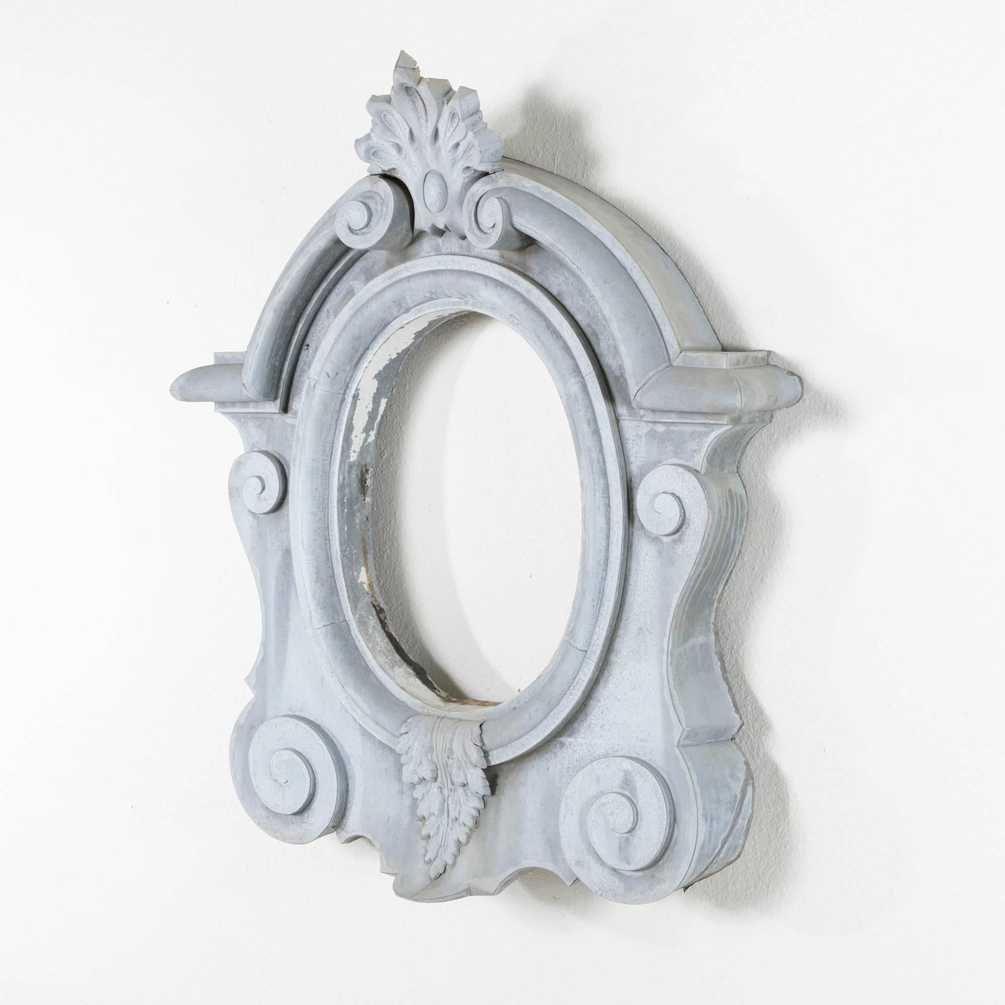 This large 19th century zinc bull's eye window, called an Oeil de Boeuf in French, was originally a dormer window in a Normandy manor house. At four feet in height, it makes an impressive statement as an architectural element hung on the wall and